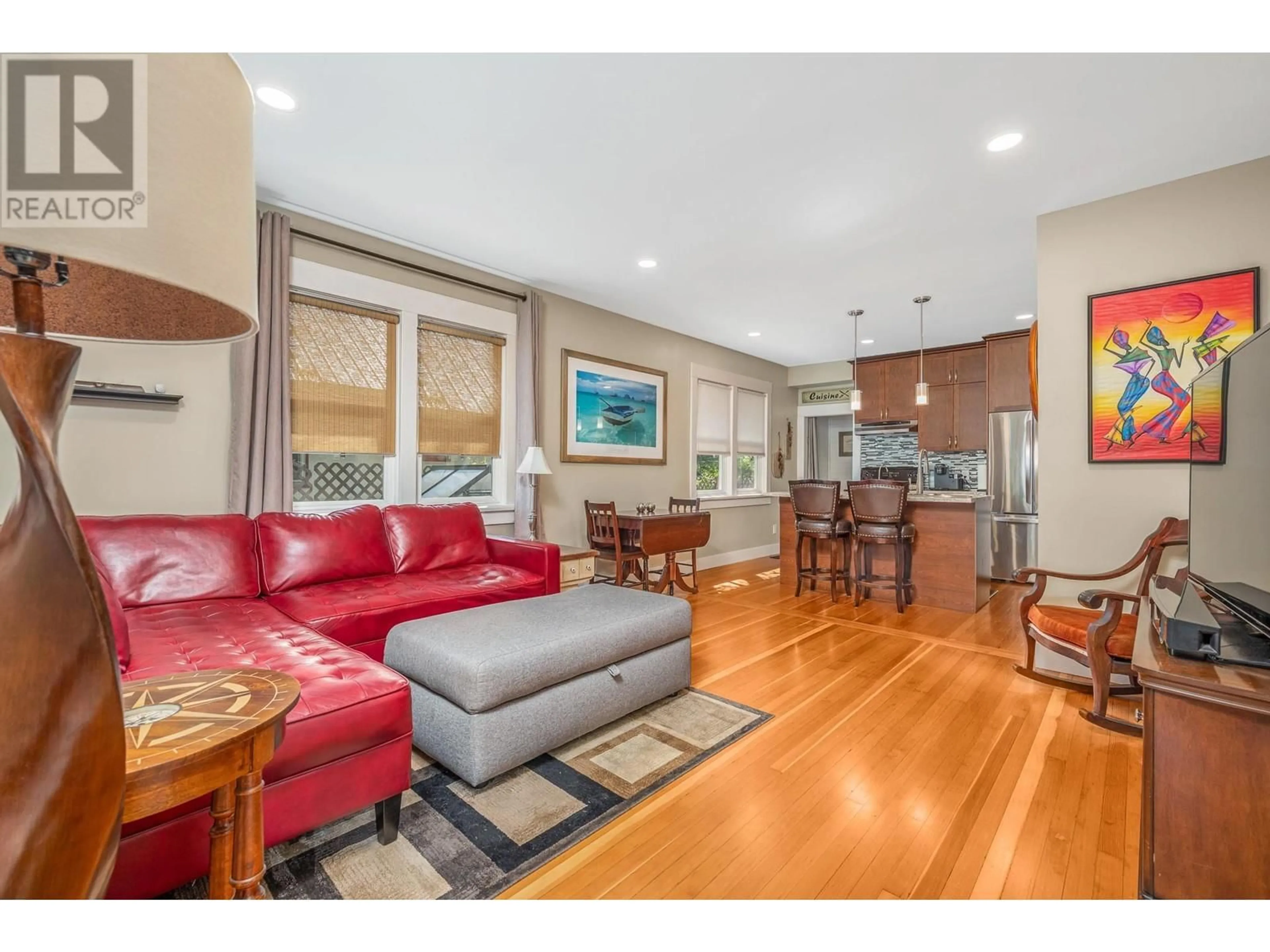 Living room with furniture, wood/laminate floor for 4204 30TH STREET, Vernon British Columbia V1T5G3