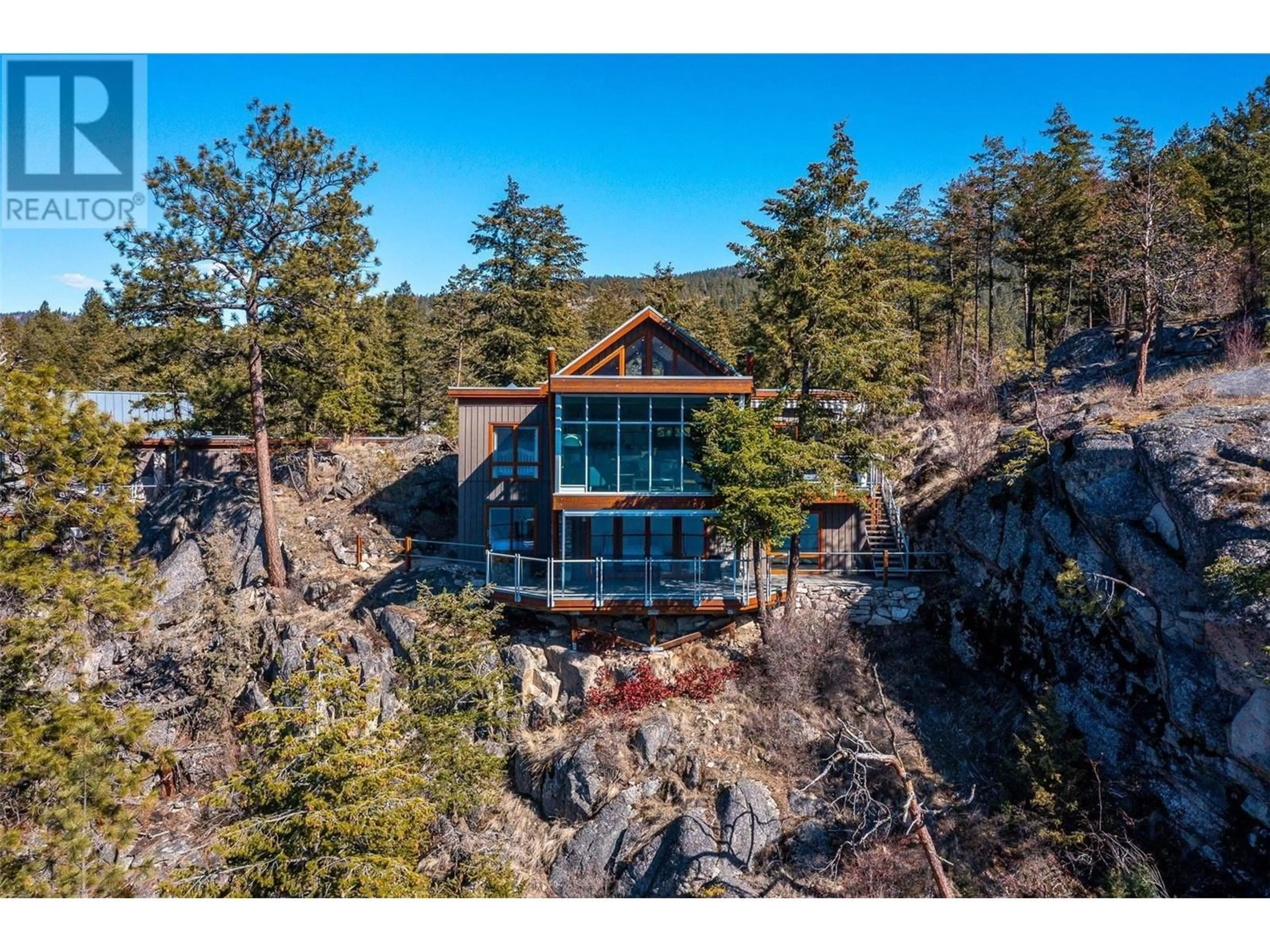 A pic from outside/outdoor area/front of a property/back of a property/a pic from drone, unknown for 159 - 9845 EASTSIDE ROAD, Vernon British Columbia V1H1Z2
