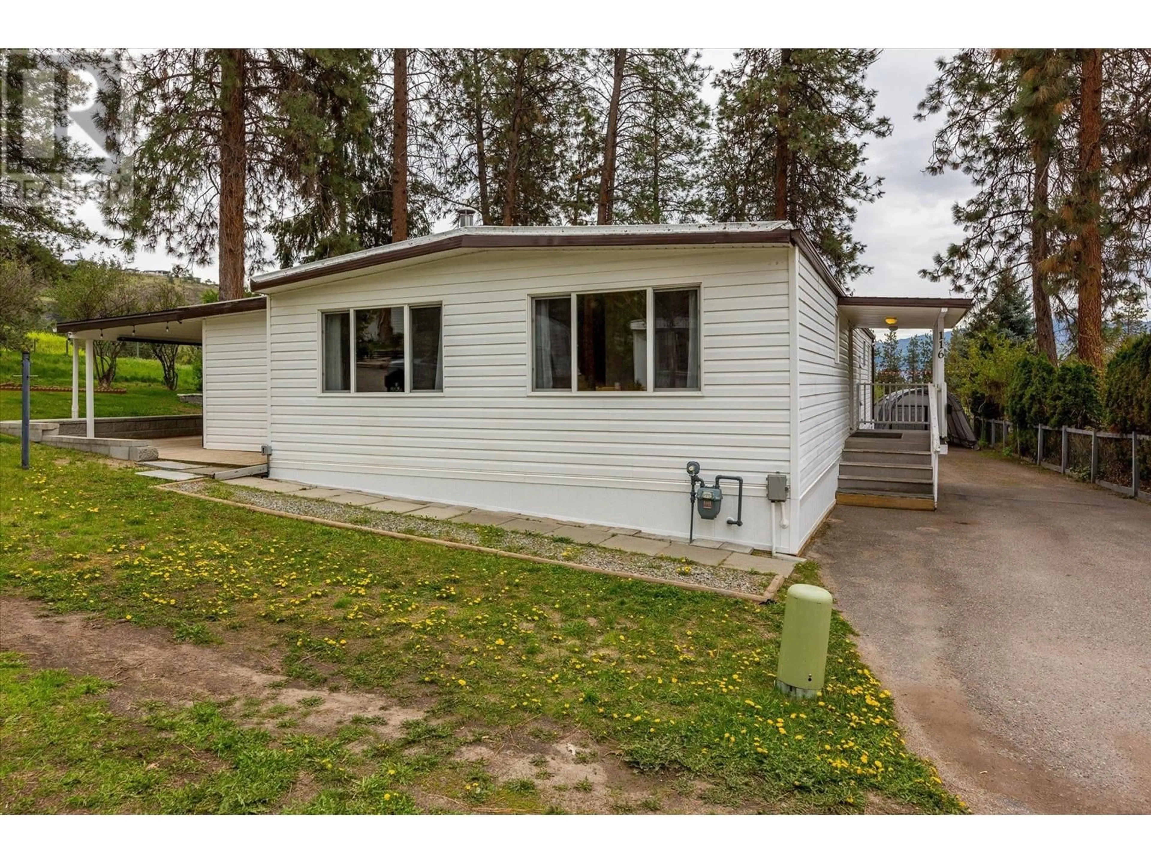 Home with vinyl exterior material, street for 116 - 1999 97 HIGHWAY SOUTH, West Kelowna British Columbia V1Z1B2