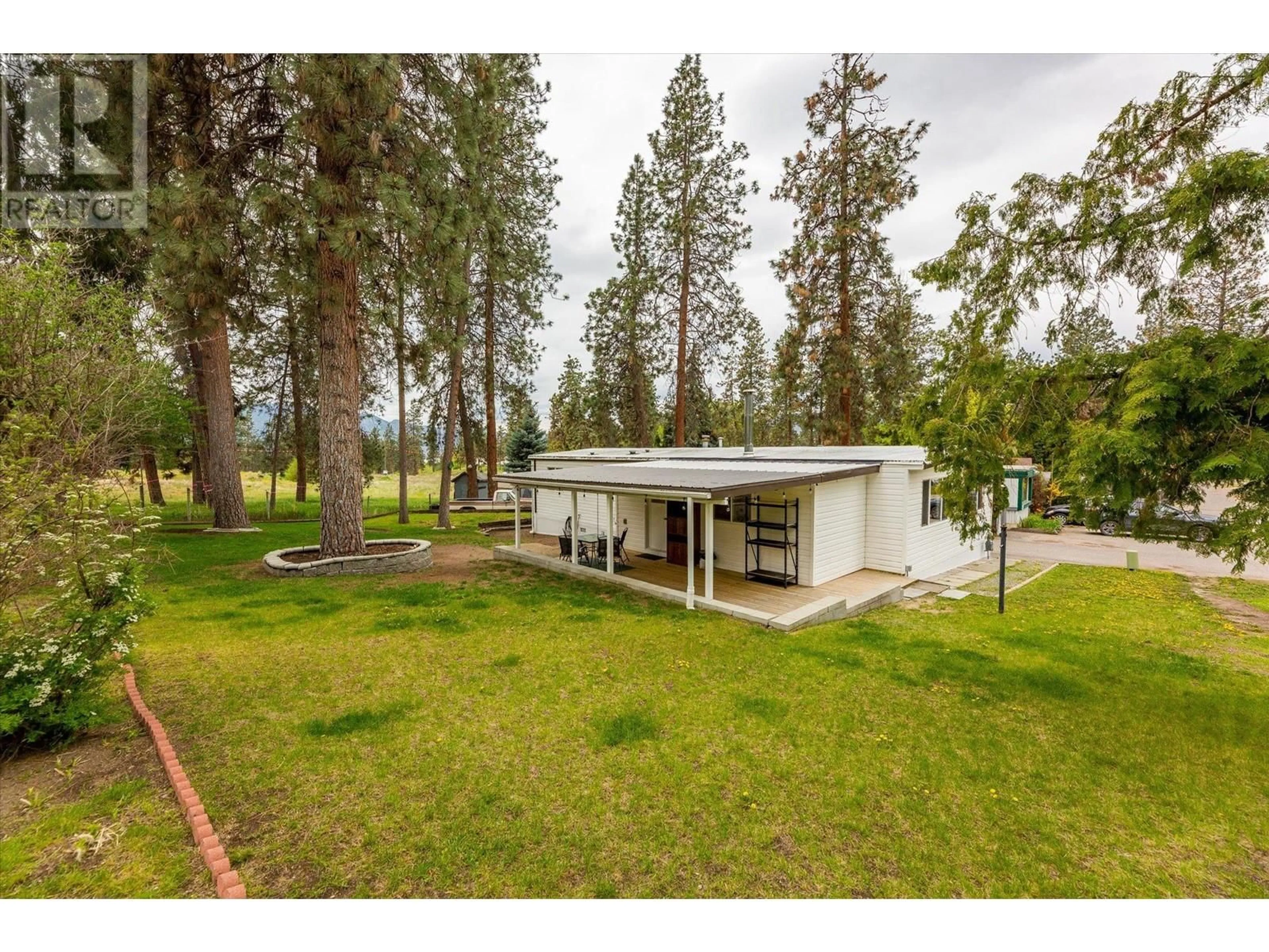 A pic from outside/outdoor area/front of a property/back of a property/a pic from drone, forest/trees view for 116 - 1999 97 HIGHWAY SOUTH, West Kelowna British Columbia V1Z1B2