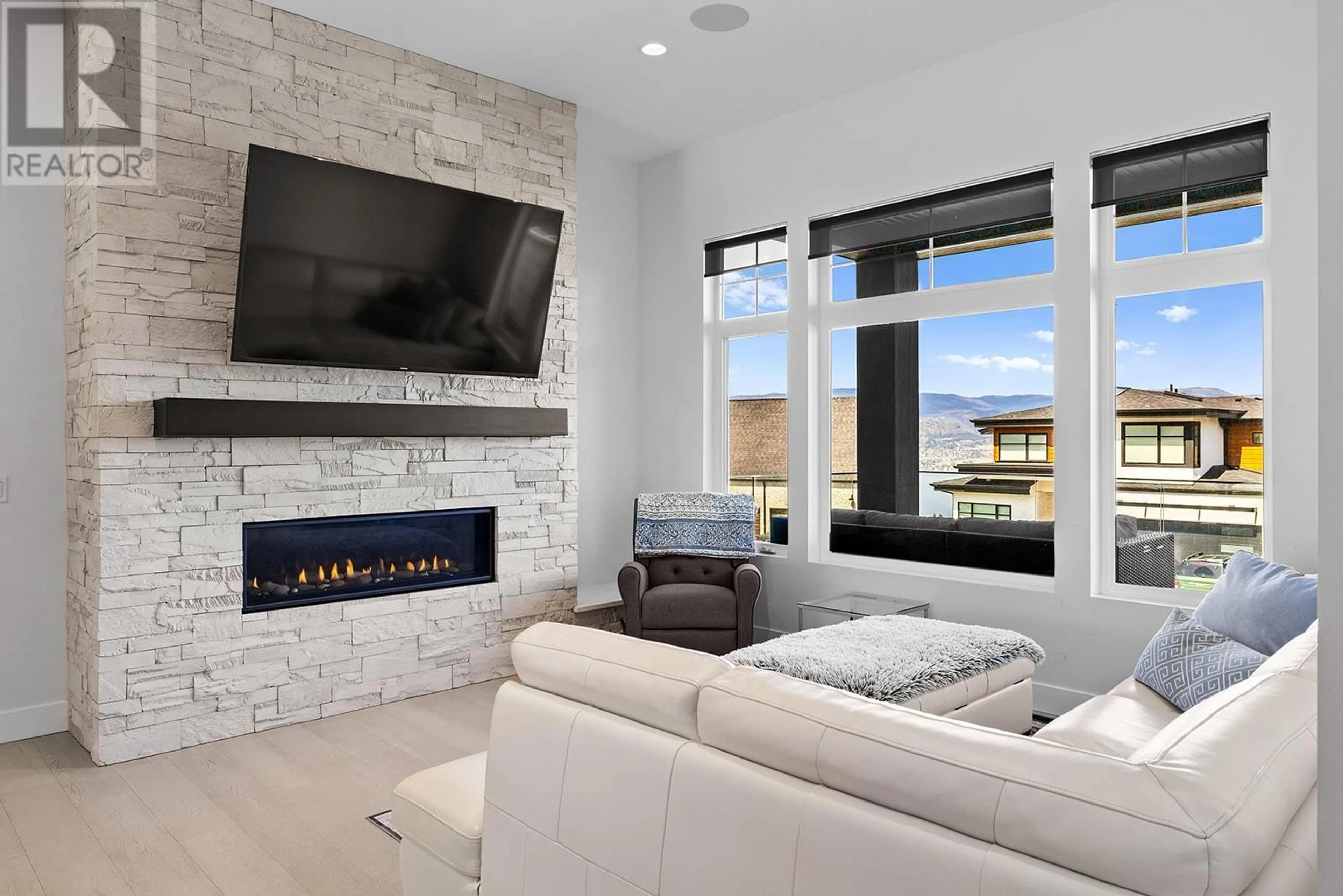 Living room with furniture, ceramic/tile floor for 443 REDTAIL COURT, Kelowna British Columbia V1W0B1