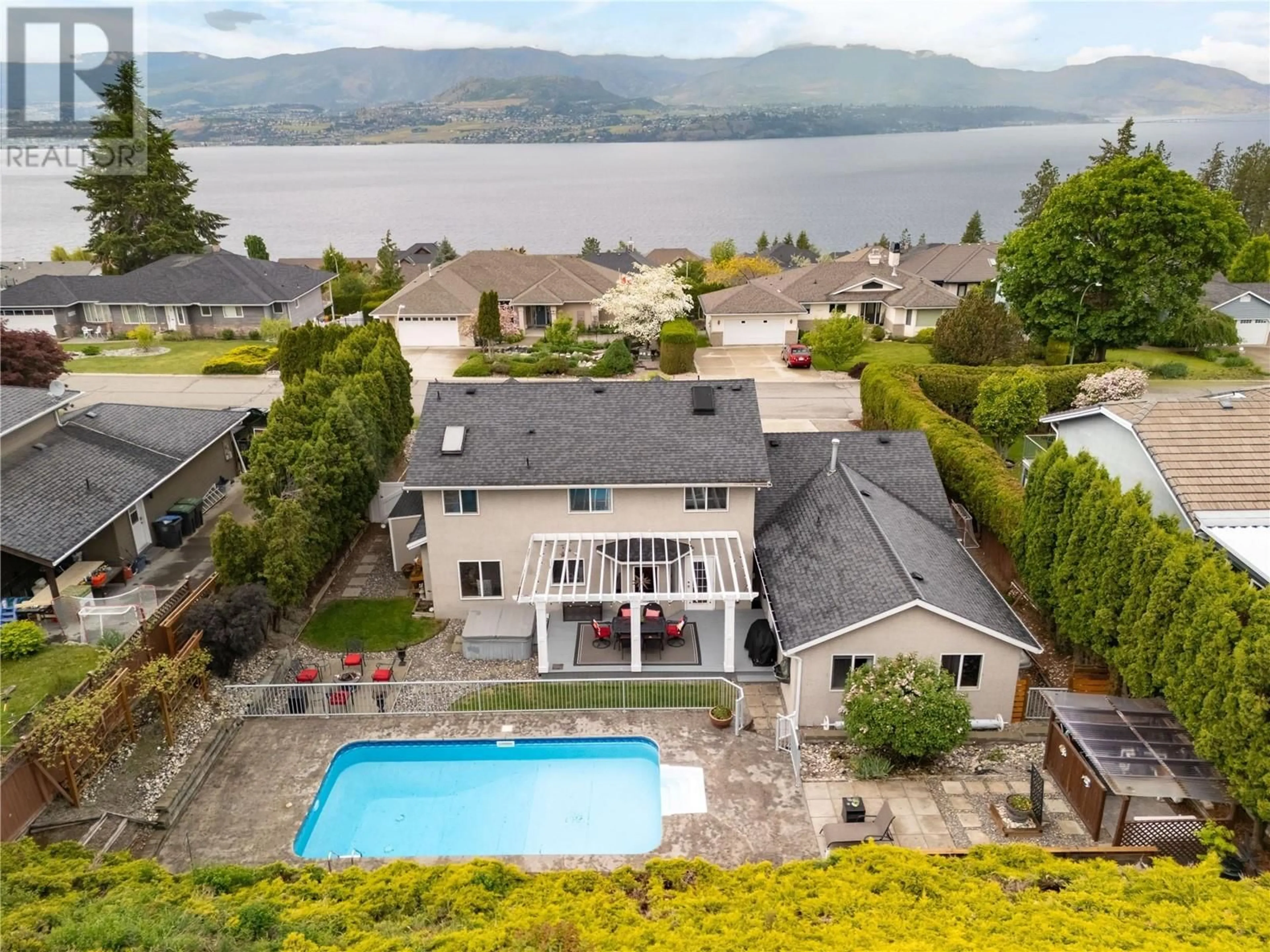 A pic from outside/outdoor area/front of a property/back of a property/a pic from drone, water/lake/river/ocean view for 438 CURLEW DRIVE, Kelowna British Columbia V1W4L2