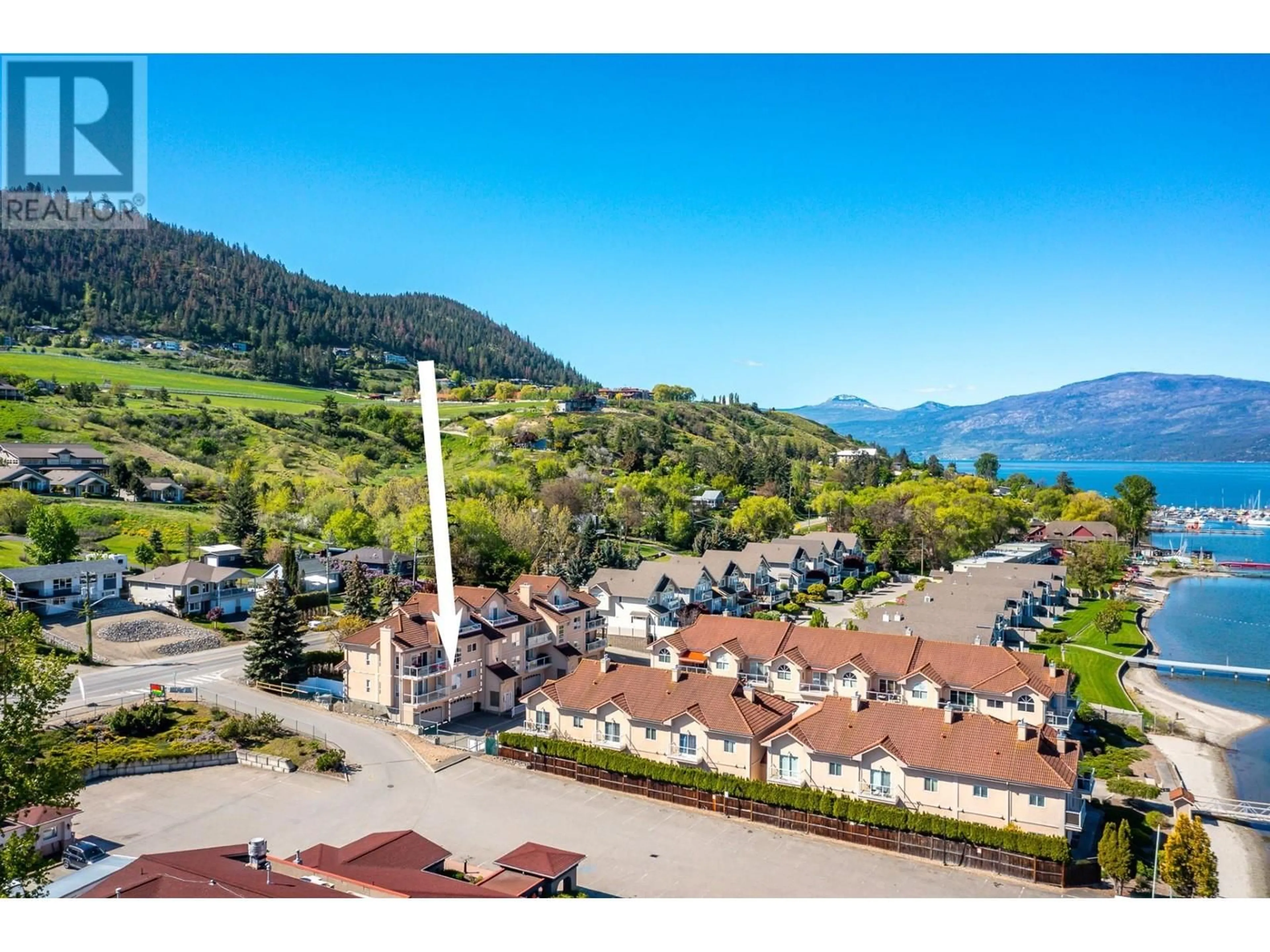 A pic from outside/outdoor area/front of a property/back of a property/a pic from drone, mountain view for 15 - 7701 OKANAGAN LANDING ROAD, Vernon British Columbia V1T6Y5