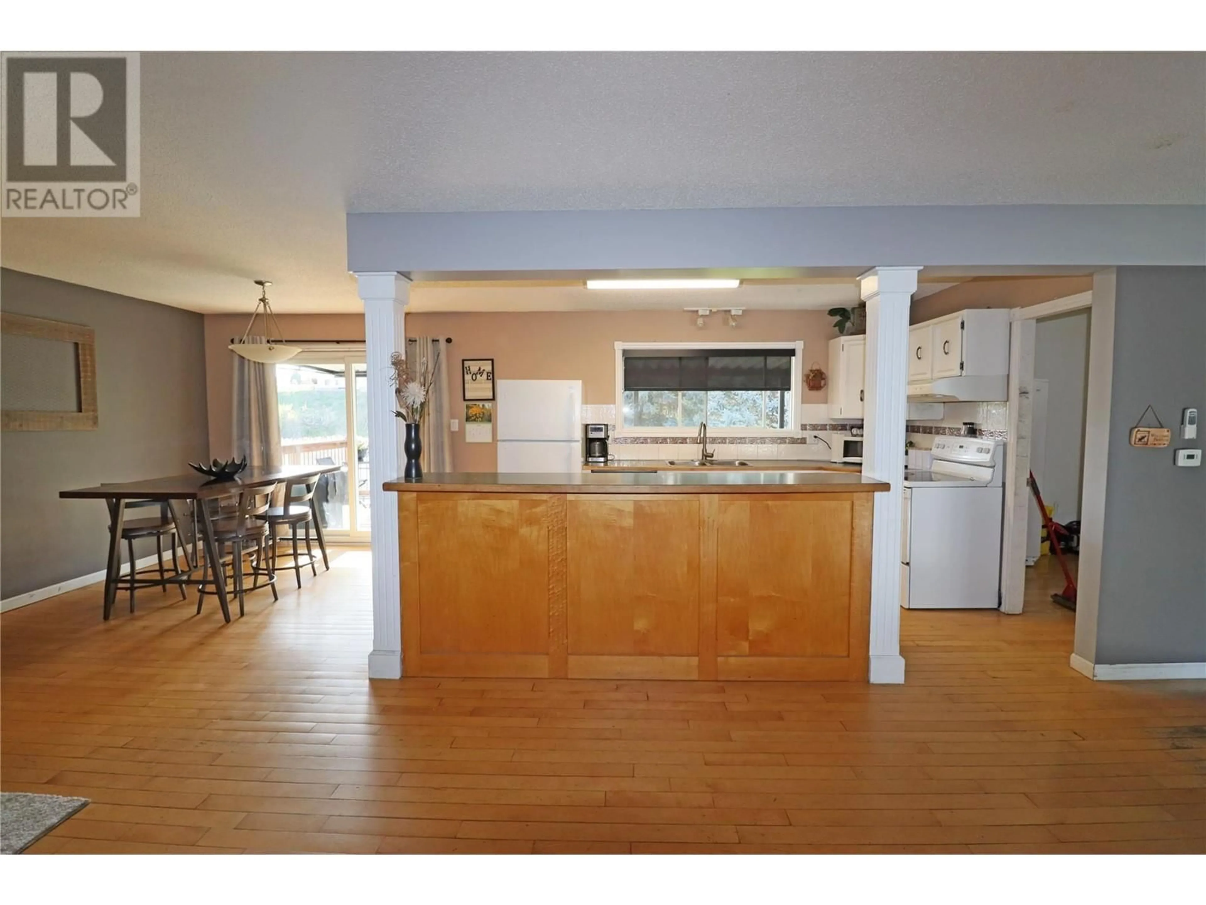 Open concept kitchen, wood/laminate floor for 7661 PHOENIX WAY, Grand Forks British Columbia V0H1H0