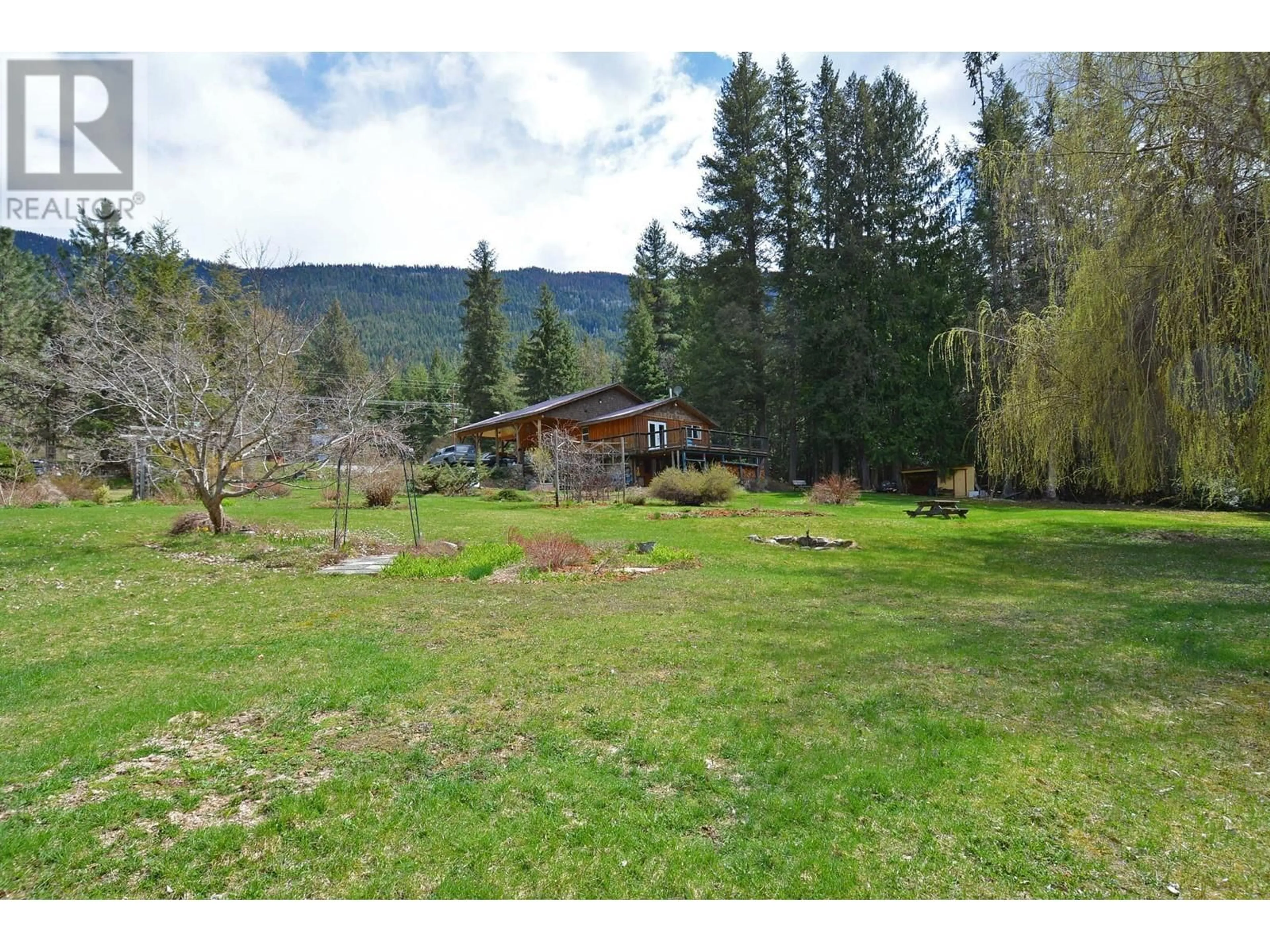 A pic from outside/outdoor area/front of a property/back of a property/a pic from drone, mountain view for 8481 6 HIGHWAY, Slocan British Columbia V1L2C0