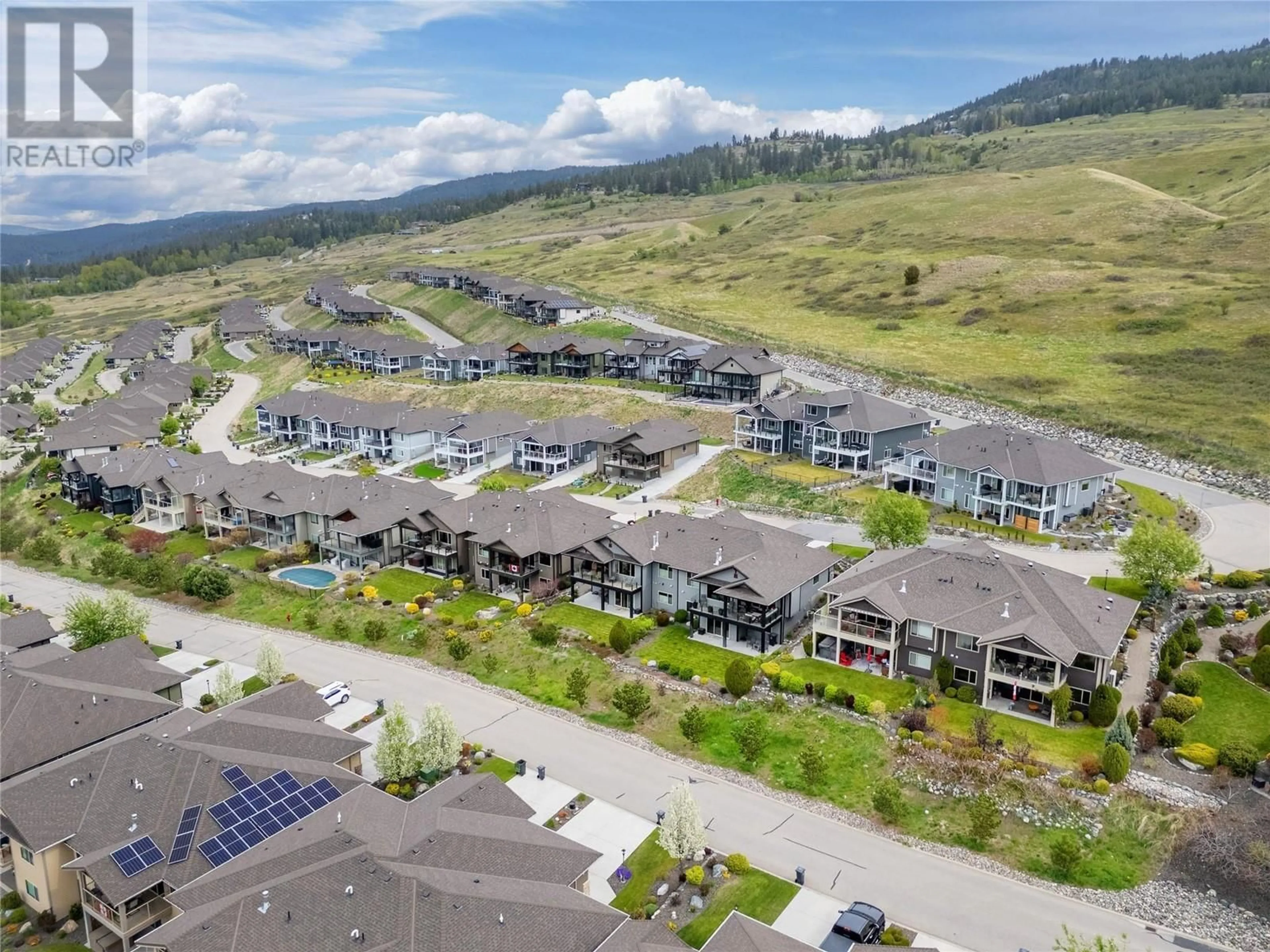 A pic from outside/outdoor area/front of a property/back of a property/a pic from drone, mountain view for 3560 RIVIERA DRIVE, Kelowna British Columbia V1X8E4