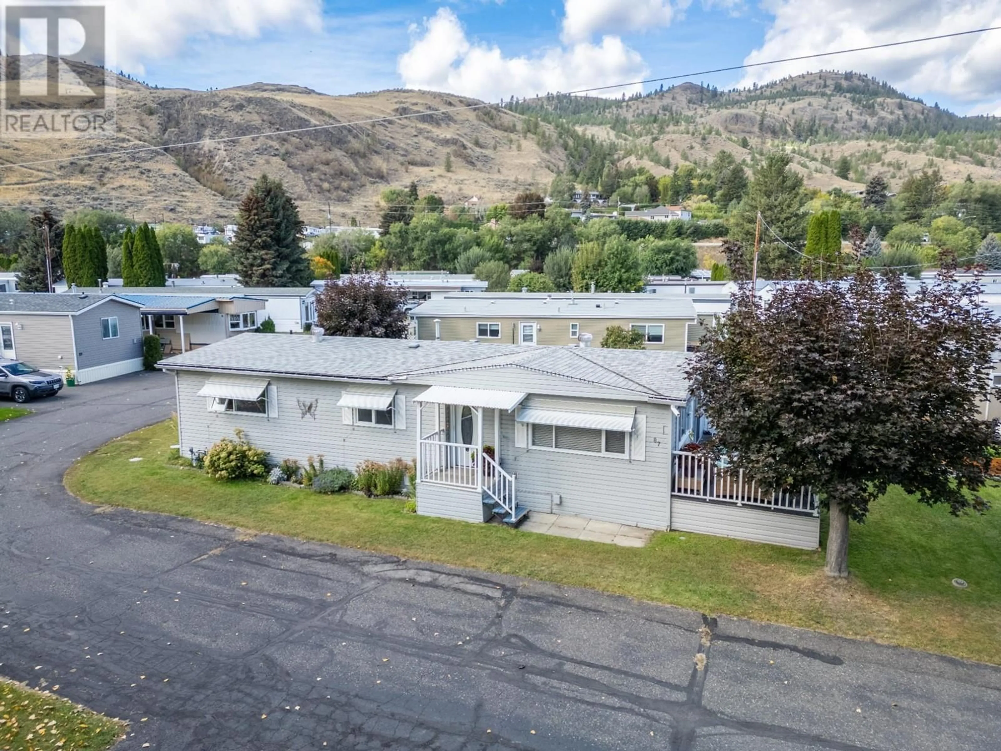 A pic from outside/outdoor area/front of a property/back of a property/a pic from drone, mountain view for 87 - 2400 OAKDALE WAY, Kamloops British Columbia V2B6W7