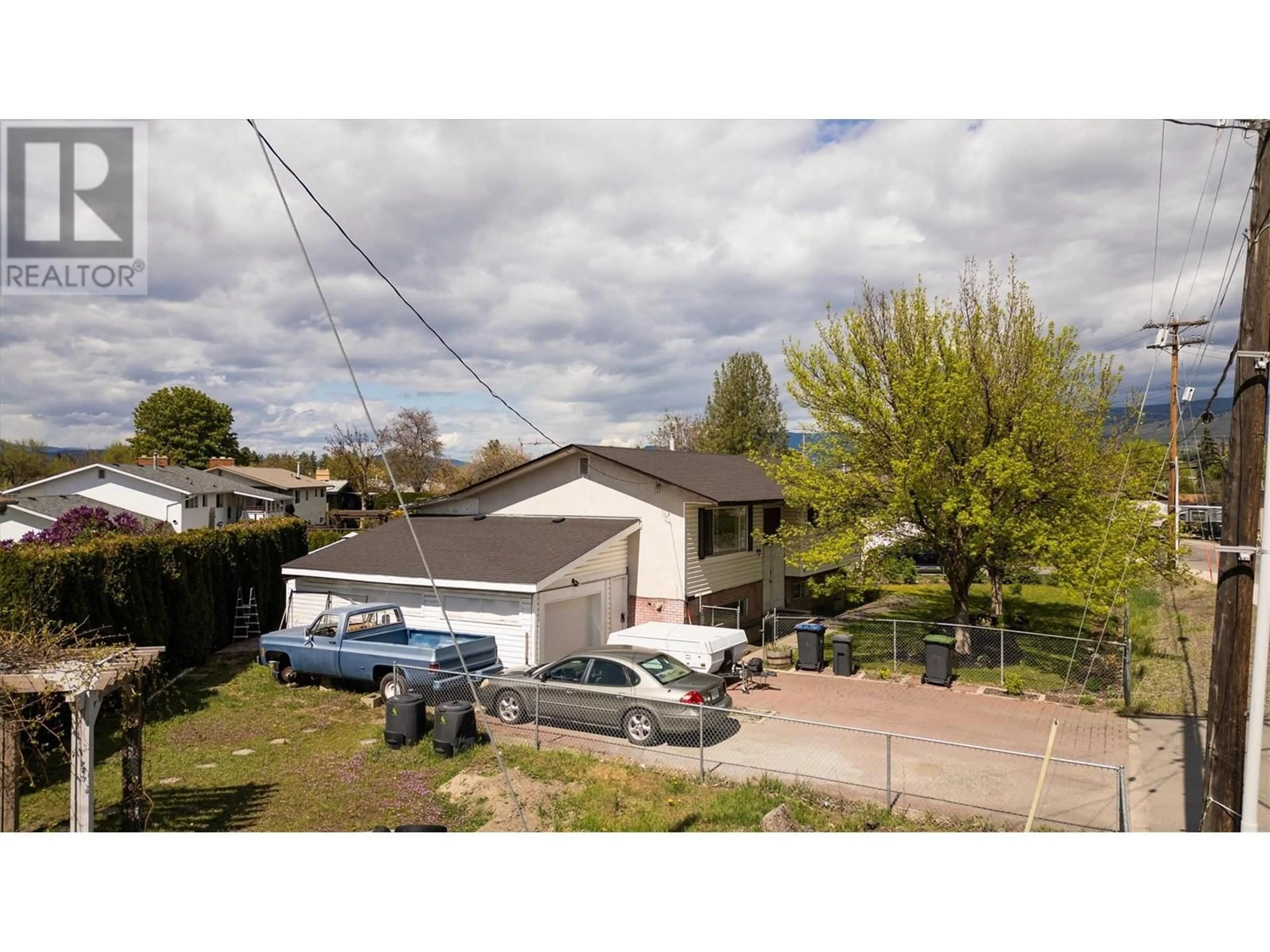 A pic from outside/outdoor area/front of a property/back of a property/a pic from drone, street for 620 RUTLAND  S ROAD, Kelowna British Columbia V1X3W1