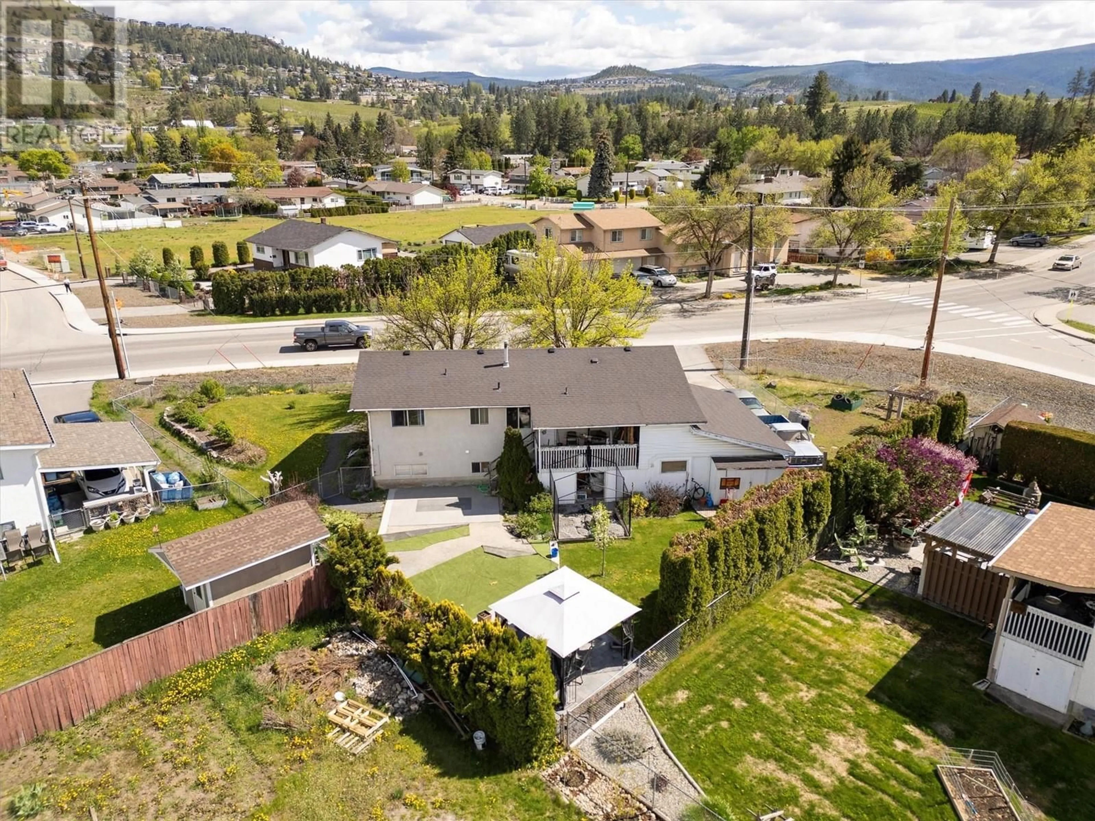 A pic from outside/outdoor area/front of a property/back of a property/a pic from drone, mountain view for 620 RUTLAND  S ROAD, Kelowna British Columbia V1X3W1