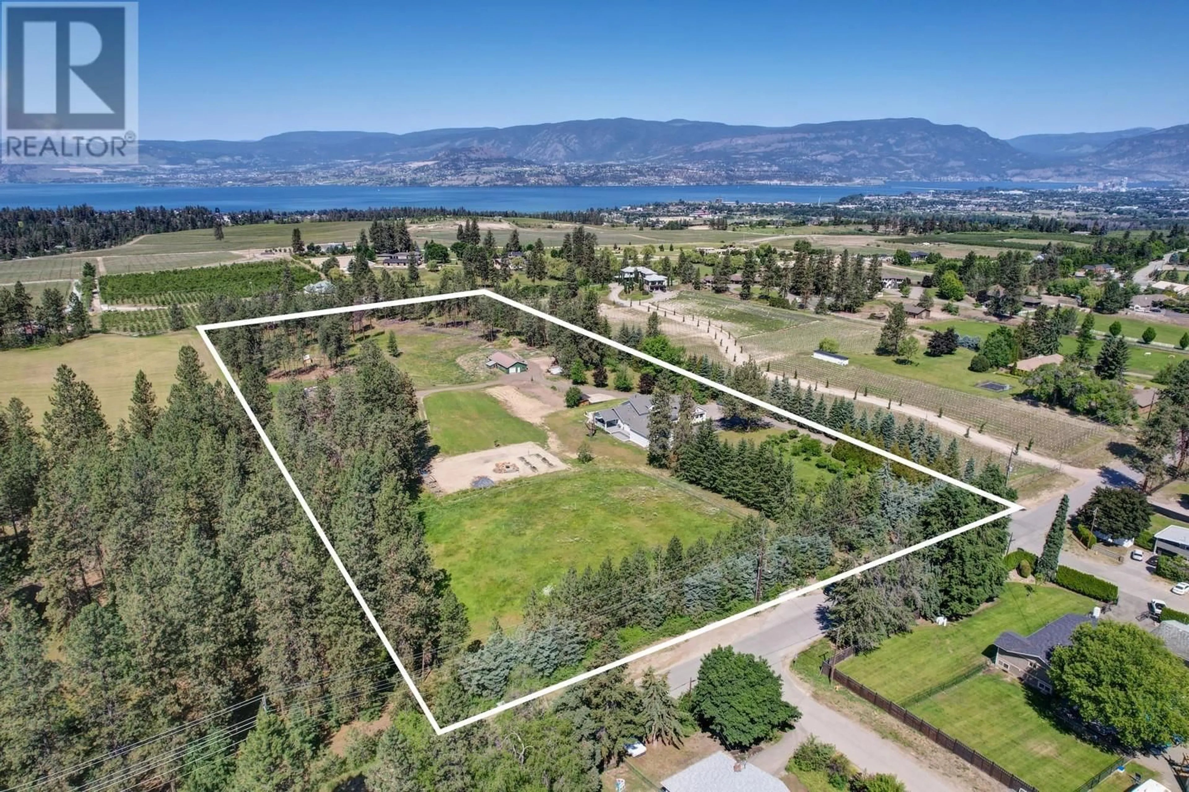 A pic from outside/outdoor area/front of a property/back of a property/a pic from drone, water/lake/river/ocean view for 4510-4520 STEWART ROAD EAST, Kelowna British Columbia V1W4C1