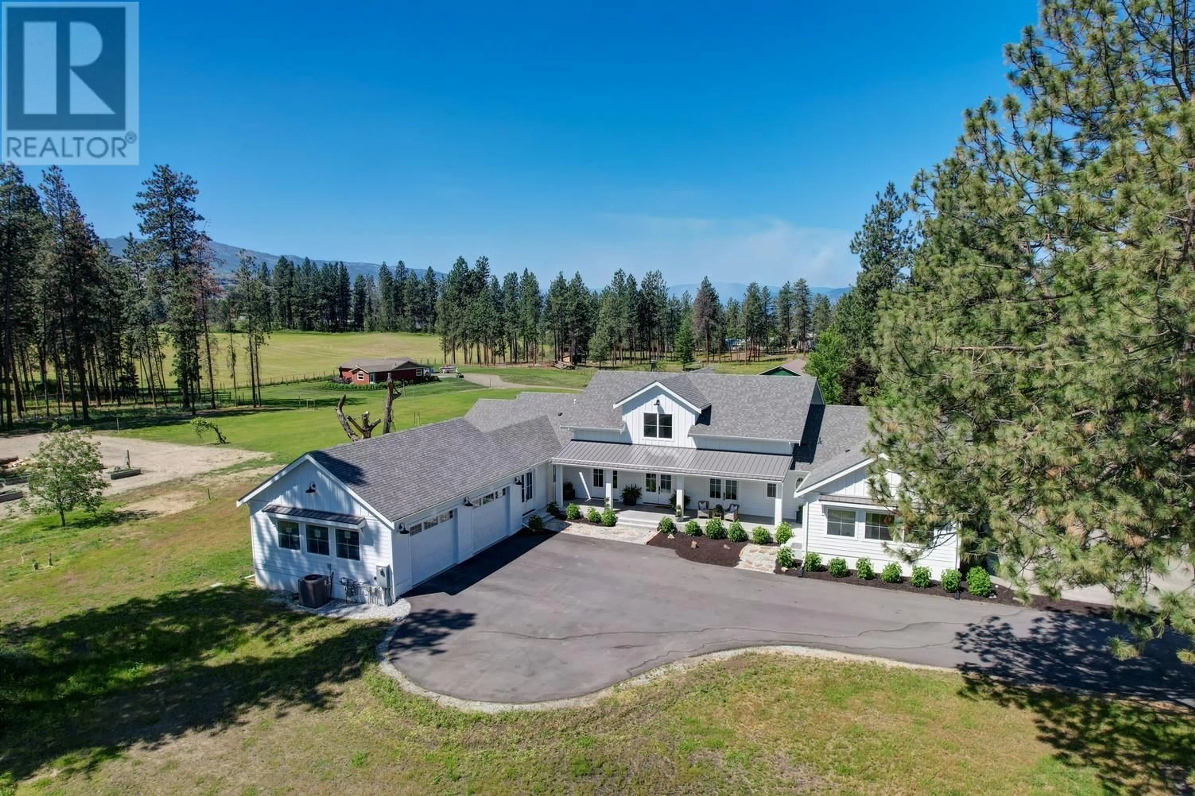 A pic from outside/outdoor area/front of a property/back of a property/a pic from drone, mountain view for 4510-4520 STEWART ROAD EAST, Kelowna British Columbia V1W4C1