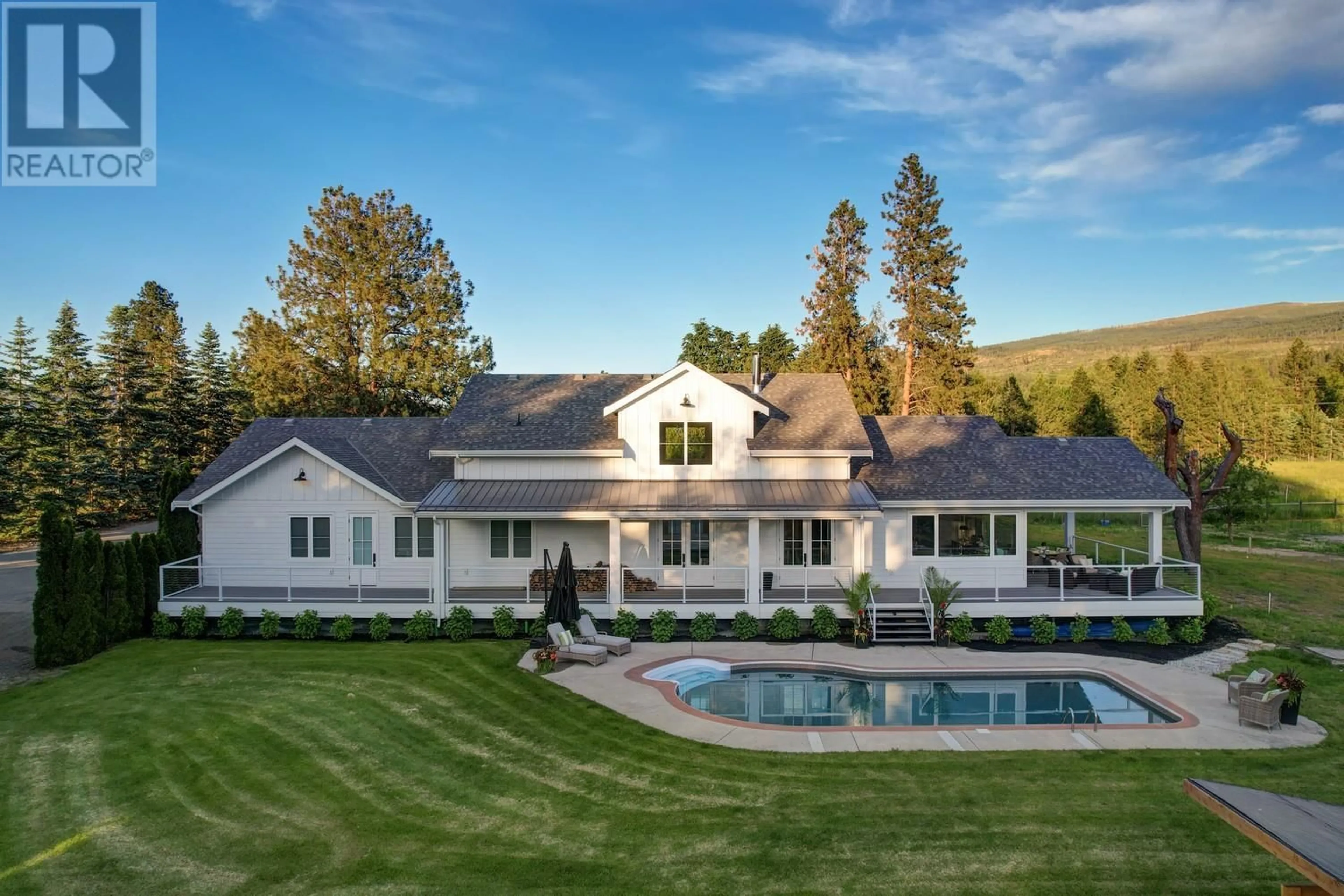 A pic from outside/outdoor area/front of a property/back of a property/a pic from drone, mountain view for 4510-4520 STEWART ROAD EAST, Kelowna British Columbia V1W4C1