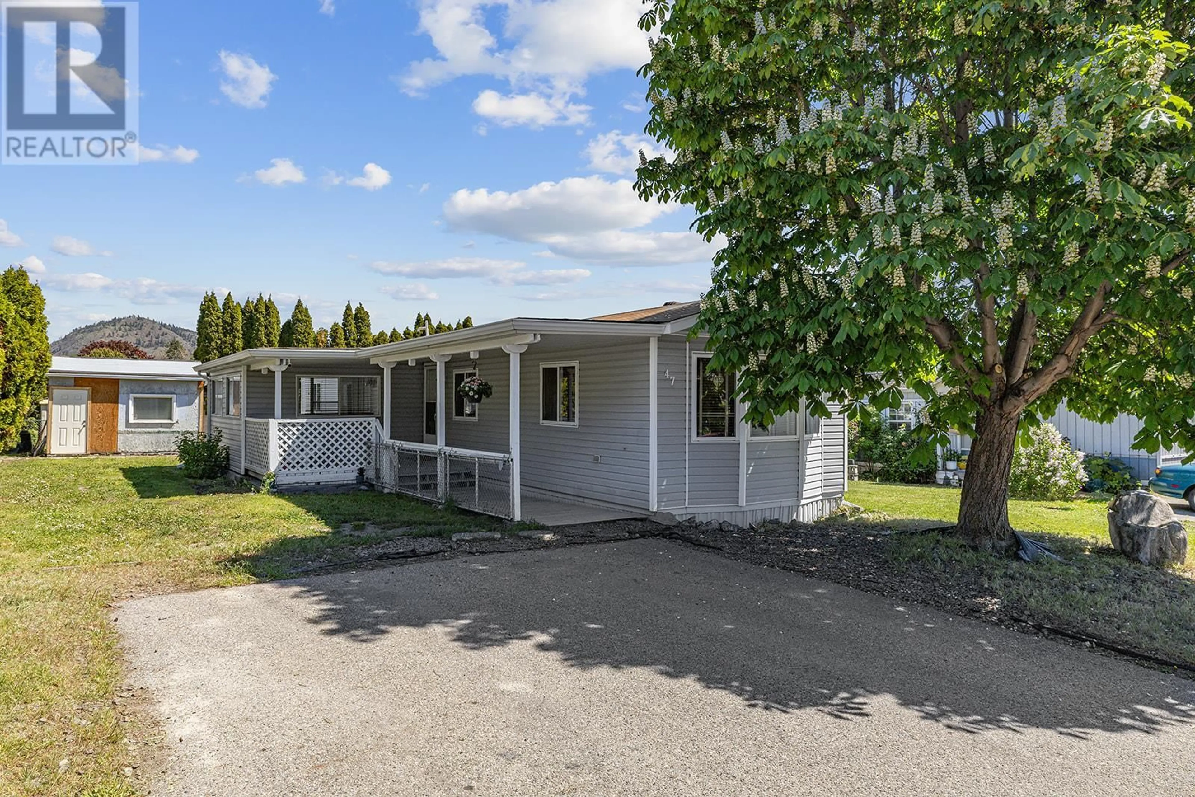 A pic from outside/outdoor area/front of a property/back of a property/a pic from drone, street for 47 - 3381 VILLAGE GREEN WAY, Westbank British Columbia V4T1L2