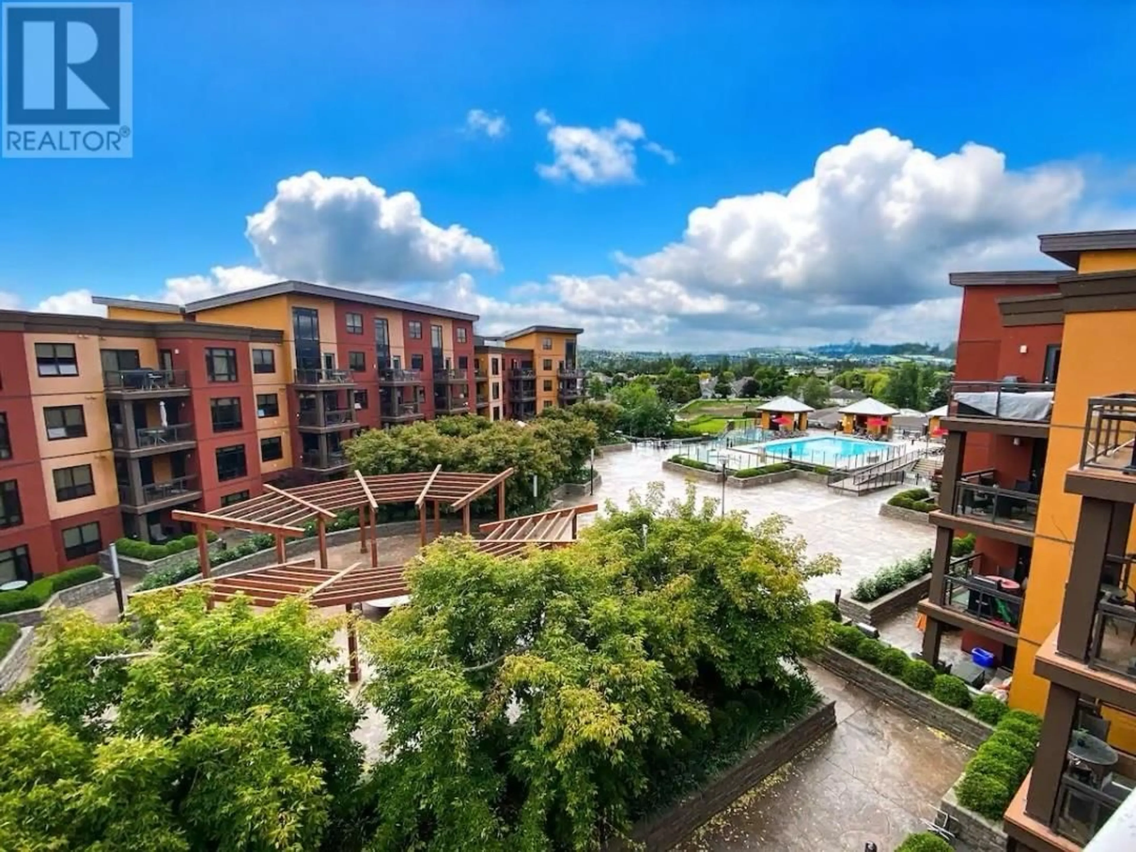 A pic from outside/outdoor area/front of a property/back of a property/a pic from drone, city buildings view from balcony for 611 - 654 COOK ROAD, Kelowna British Columbia V1W3G7