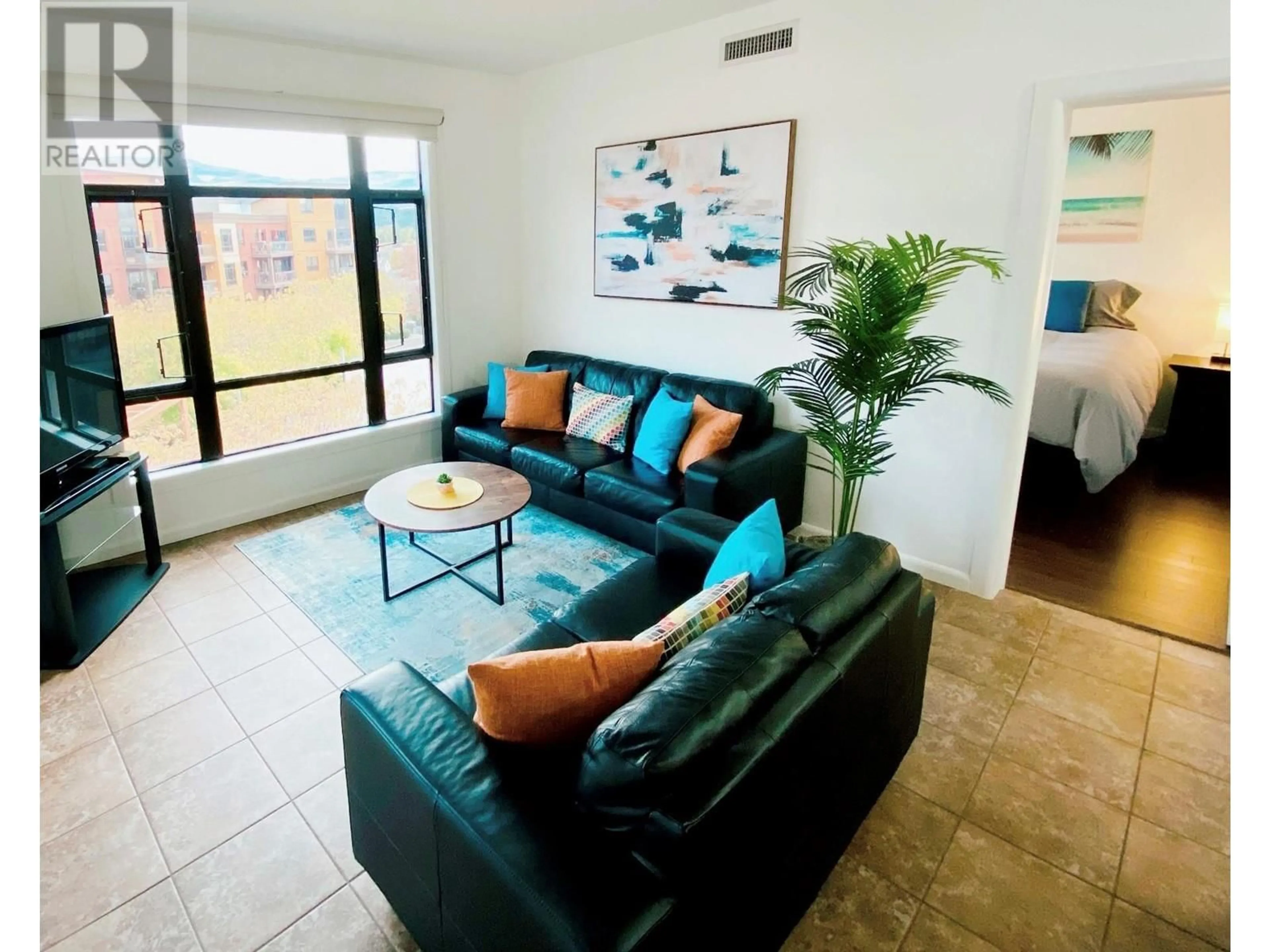 Living room with furniture, ceramic/tile floor for 611 - 654 COOK ROAD, Kelowna British Columbia V1W3G7