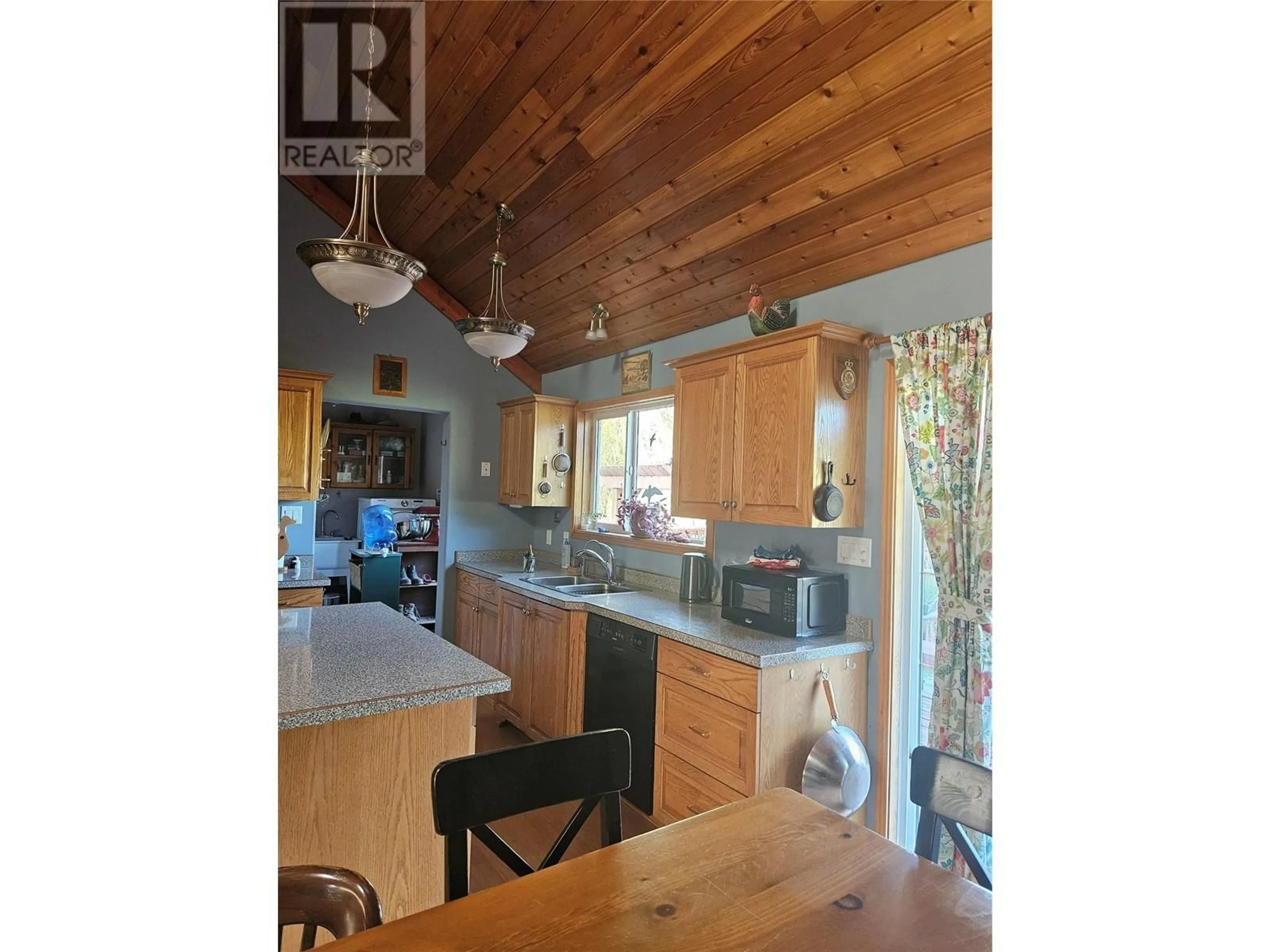 Open concept kitchen, wood/laminate floor for 695 BROUSE LOOP ROAD, Nakusp British Columbia V0G1R1