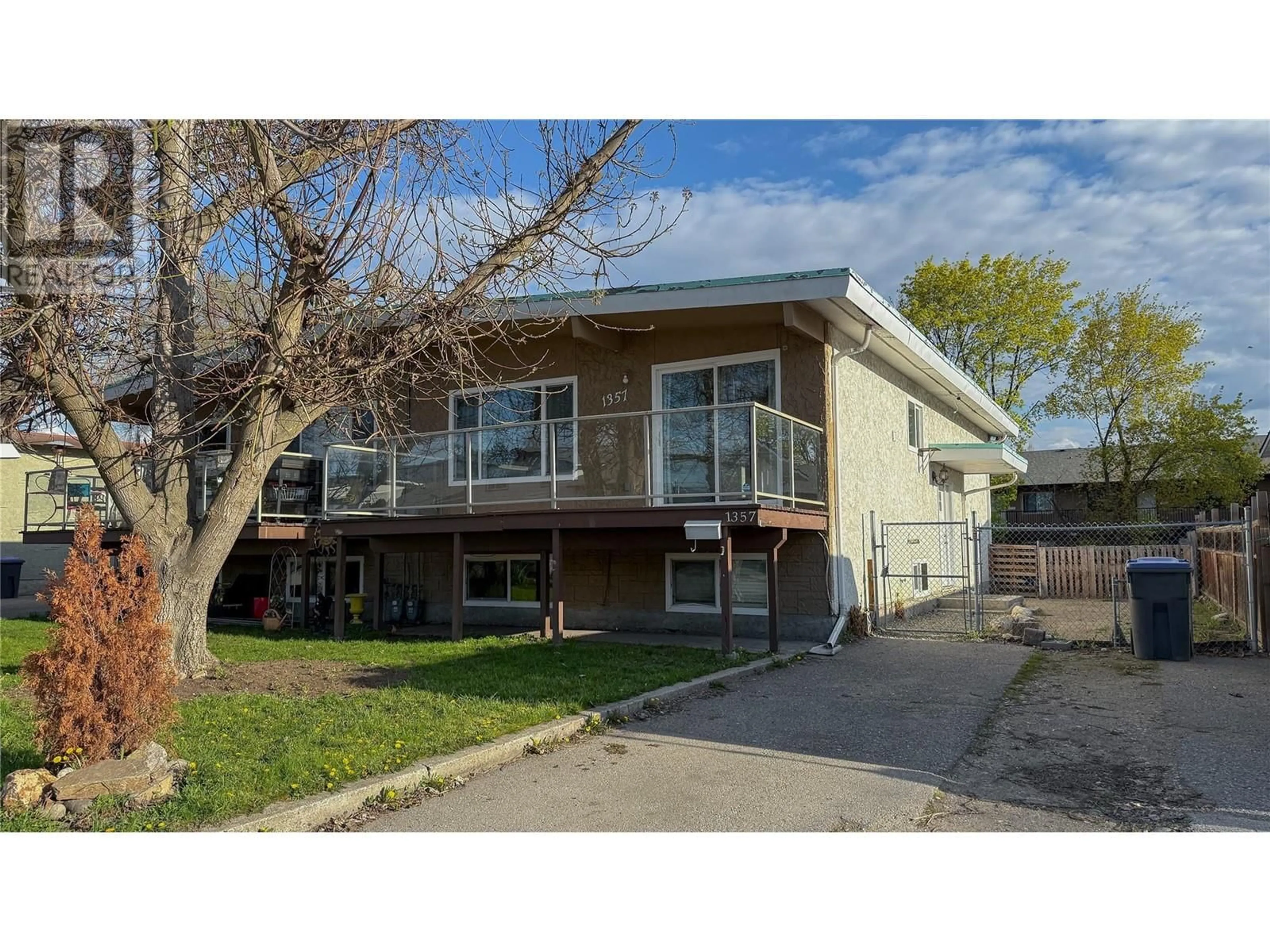 Home with vinyl exterior material, street for 1355/1357 SYLVANIA CRESCENT, Kelowna British Columbia V1X5J4