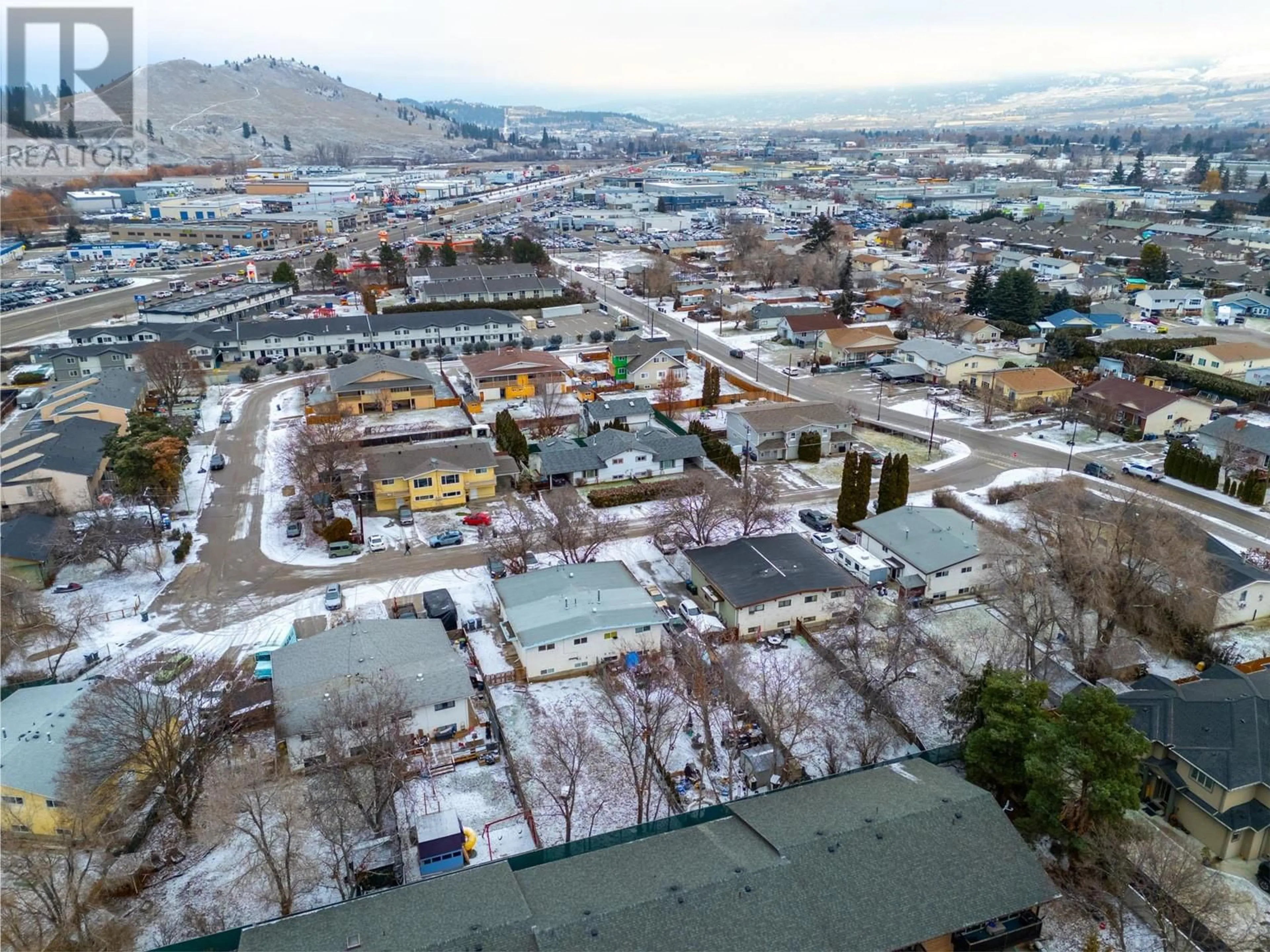 A pic from outside/outdoor area/front of a property/back of a property/a pic from drone, mountain view for 1355/1357 SYLVANIA CRESCENT, Kelowna British Columbia V1X5J4