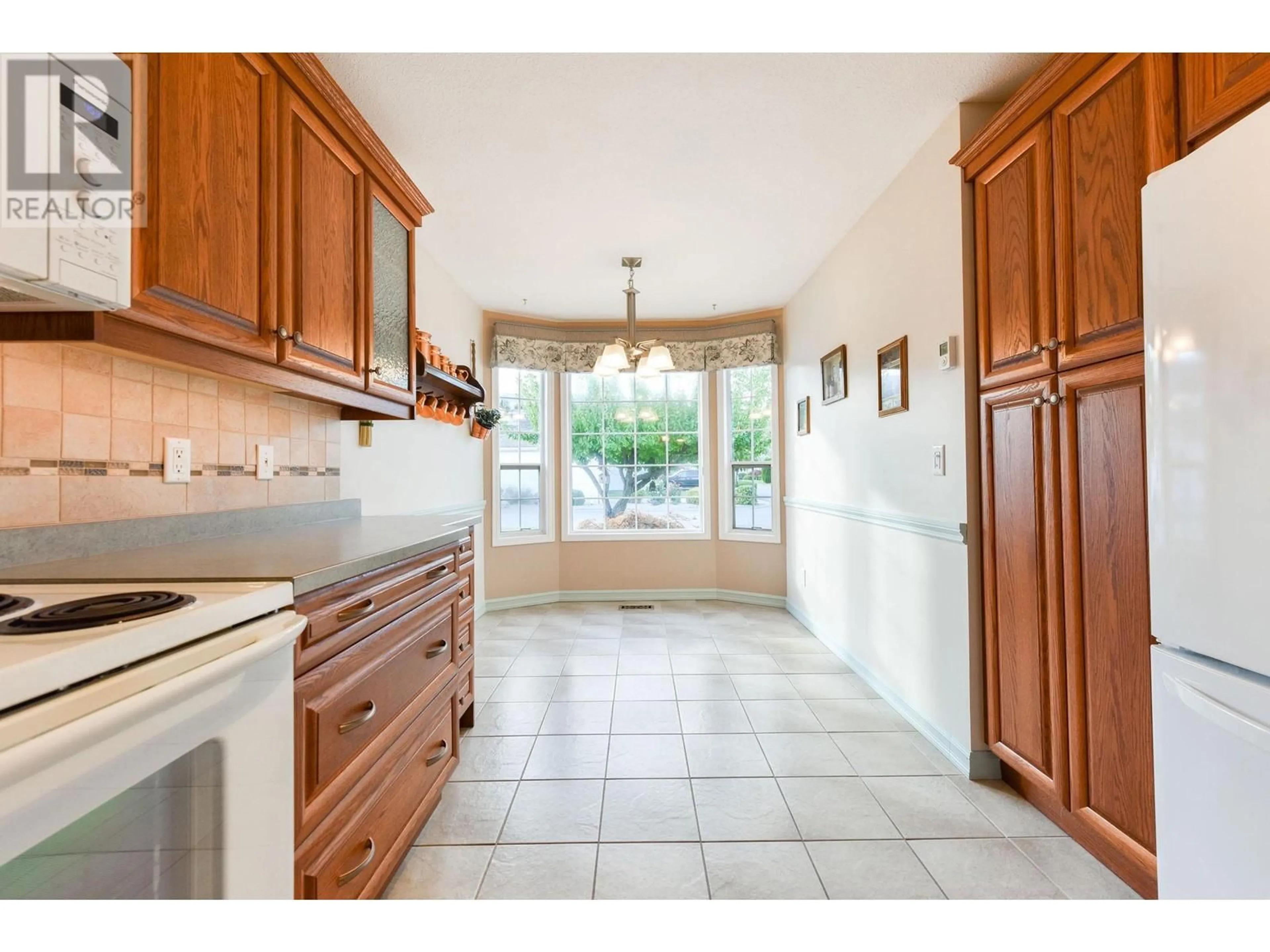 Open concept kitchen, ceramic/tile floor for 27 KINGFISHER DRIVE, Penticton British Columbia V2A8K6