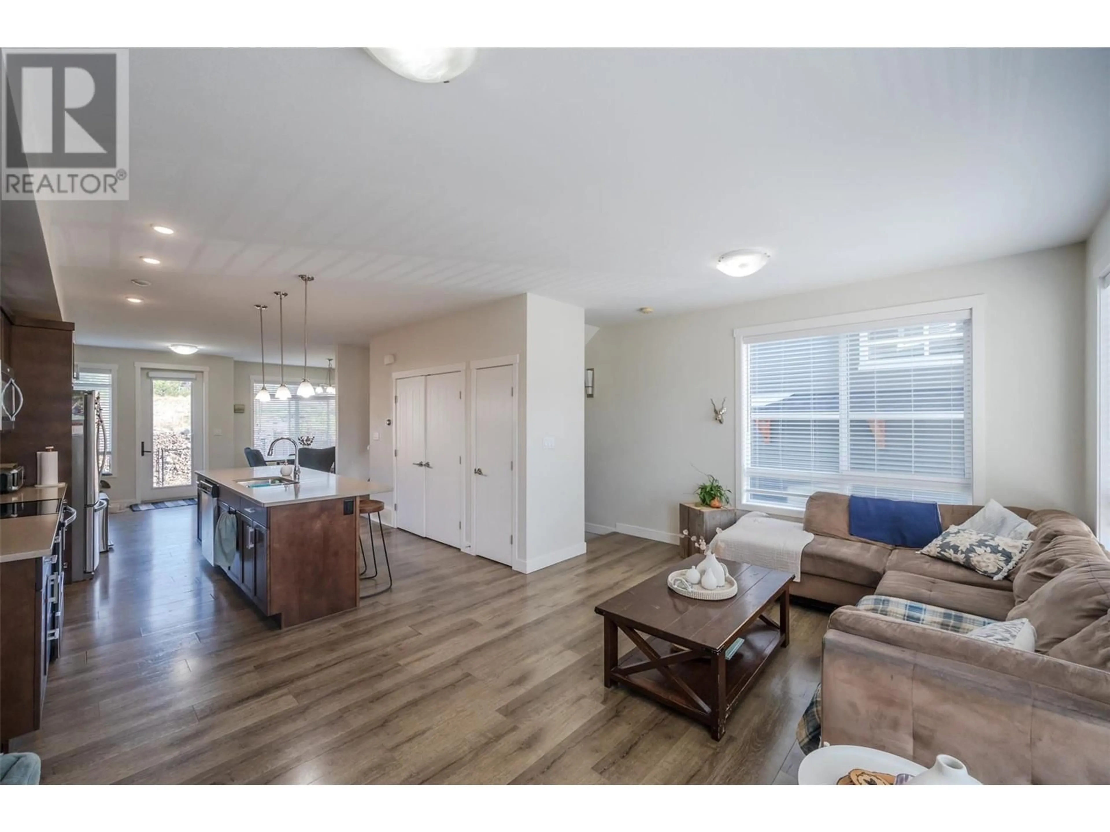 Living room with furniture, wood/laminate floor for 136 - 1115 HOLDEN ROAD, Penticton British Columbia V2A0B7