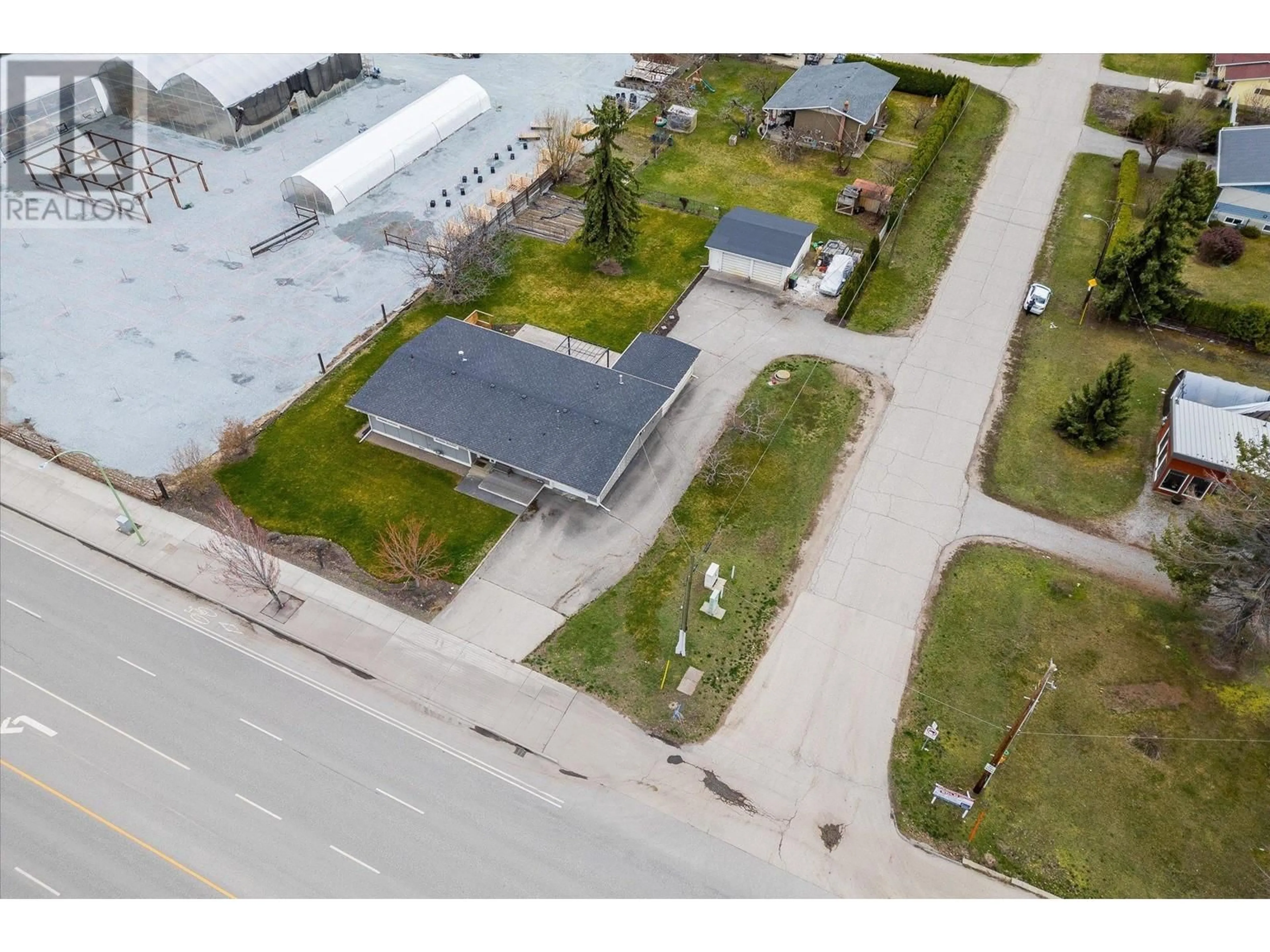 A pic from outside/outdoor area/front of a property/back of a property/a pic from drone, building for 1599 K.L.O. ROAD, Kelowna British Columbia V1W3P3
