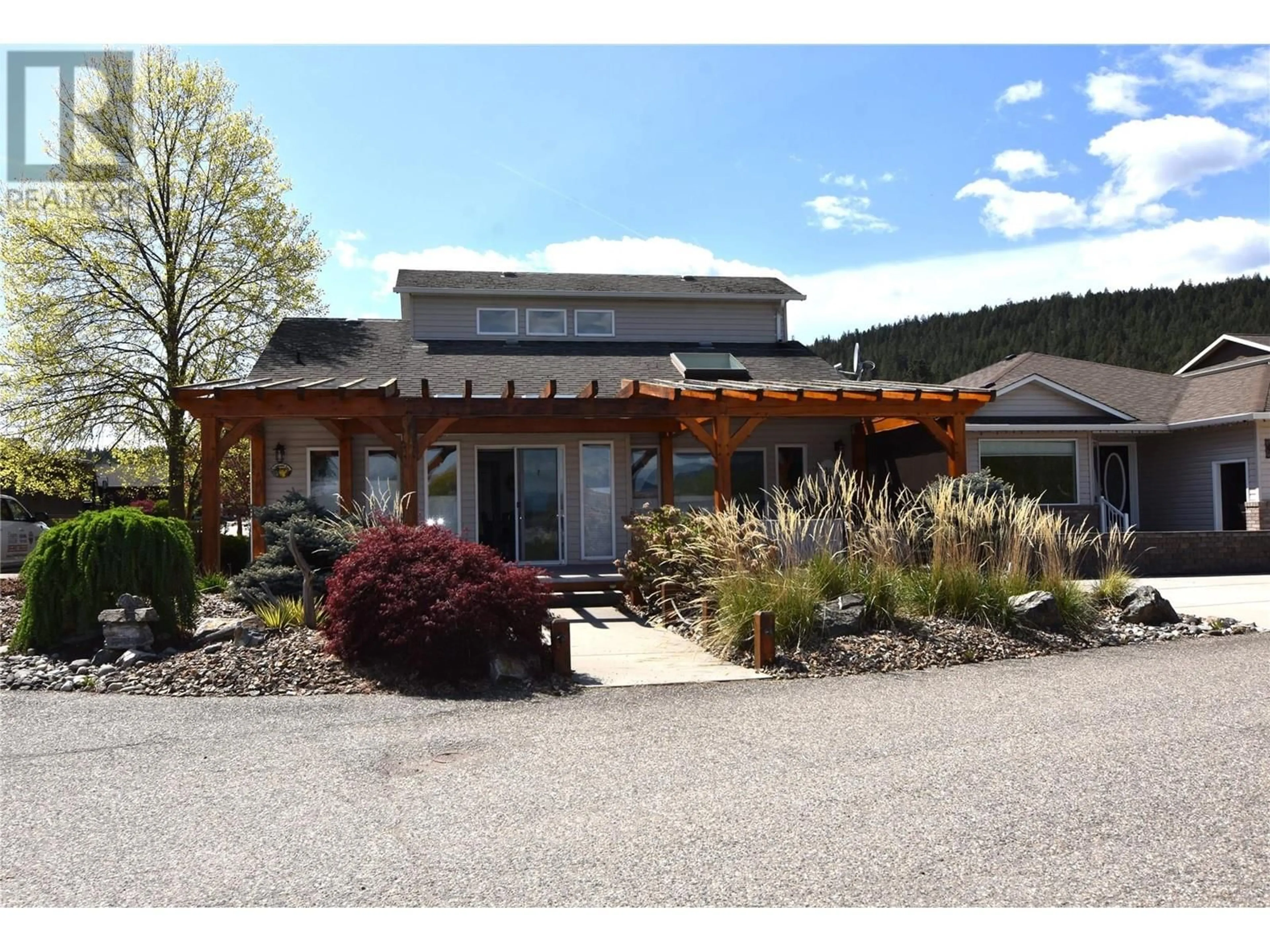 A pic from outside/outdoor area/front of a property/back of a property/a pic from drone, mountain view for 605 ELK STREET, Vernon British Columbia V1H2A1