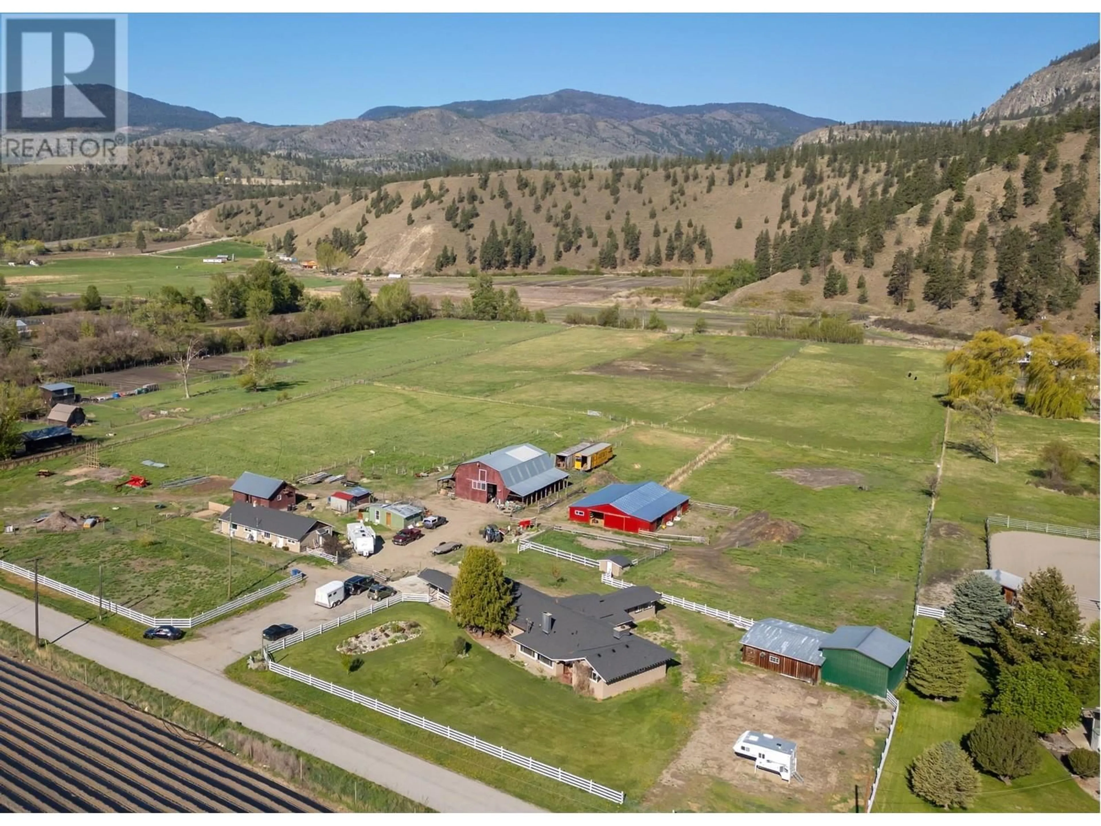 A pic from outside/outdoor area/front of a property/back of a property/a pic from drone, mountain view for 8134 RIVER ROAD, Oliver British Columbia V0H1T5