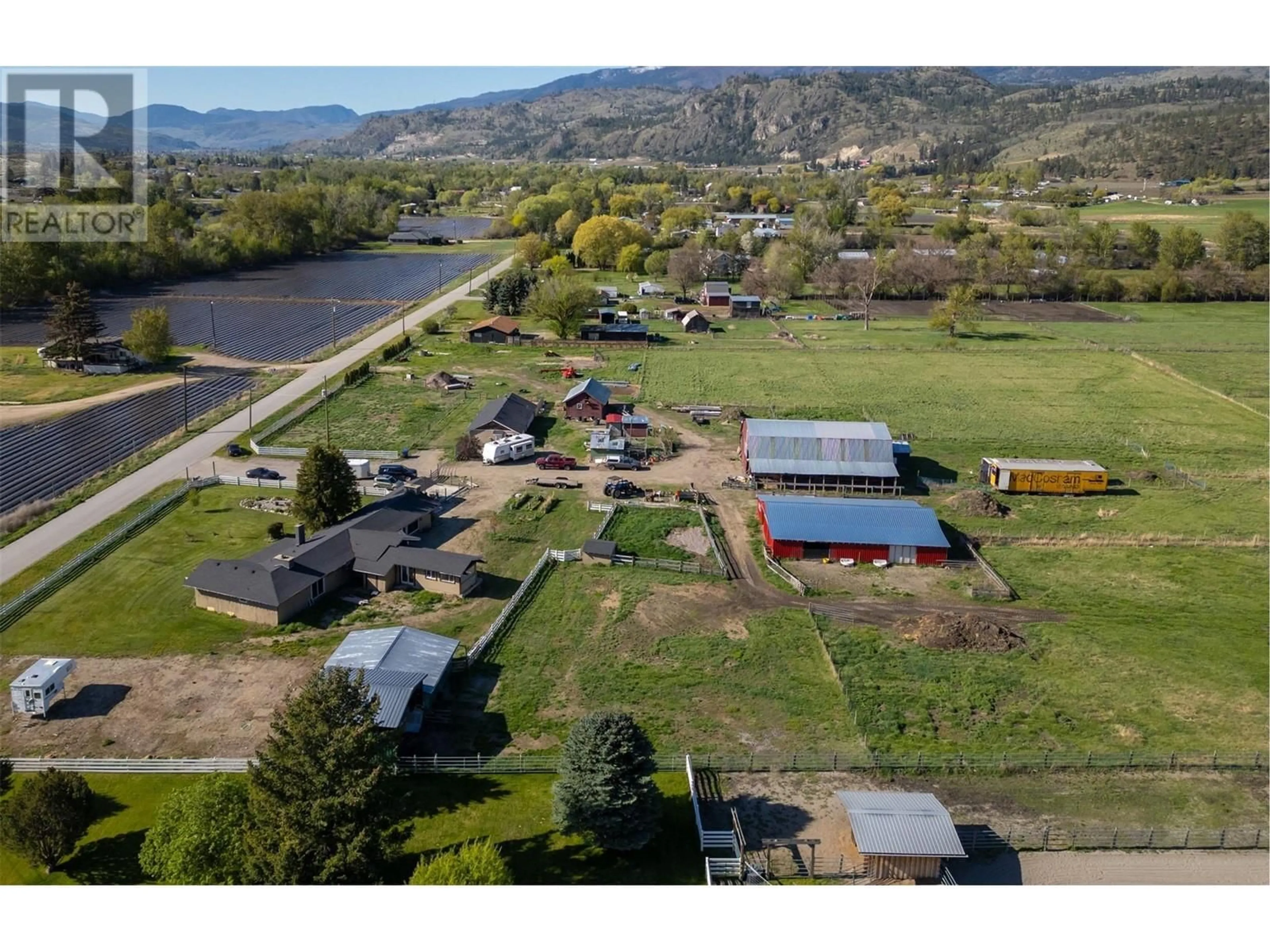 A pic from outside/outdoor area/front of a property/back of a property/a pic from drone, mountain view for 8134 RIVER ROAD, Oliver British Columbia V0H1T5