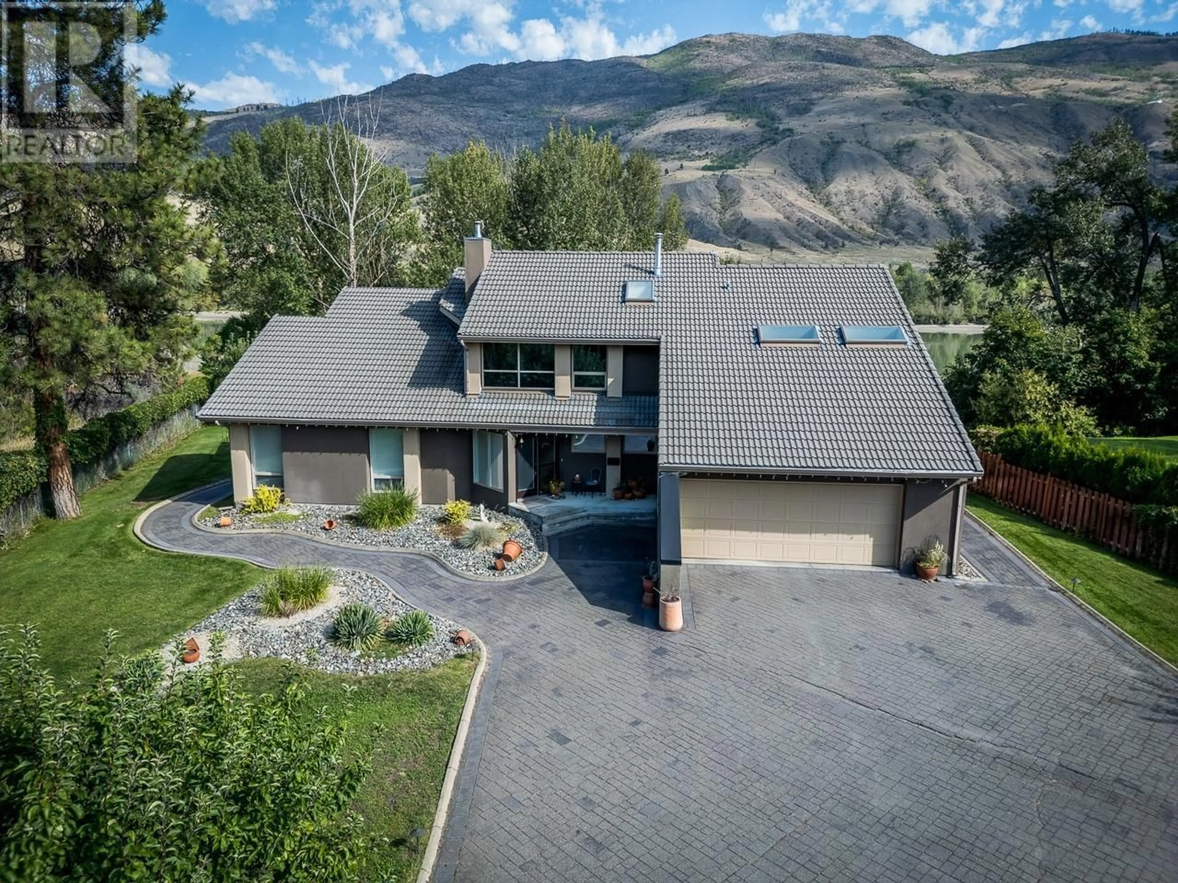 A pic from outside/outdoor area/front of a property/back of a property/a pic from drone, mountain view for 604 STANSFIELD ROAD, Kamloops British Columbia V2B6M3