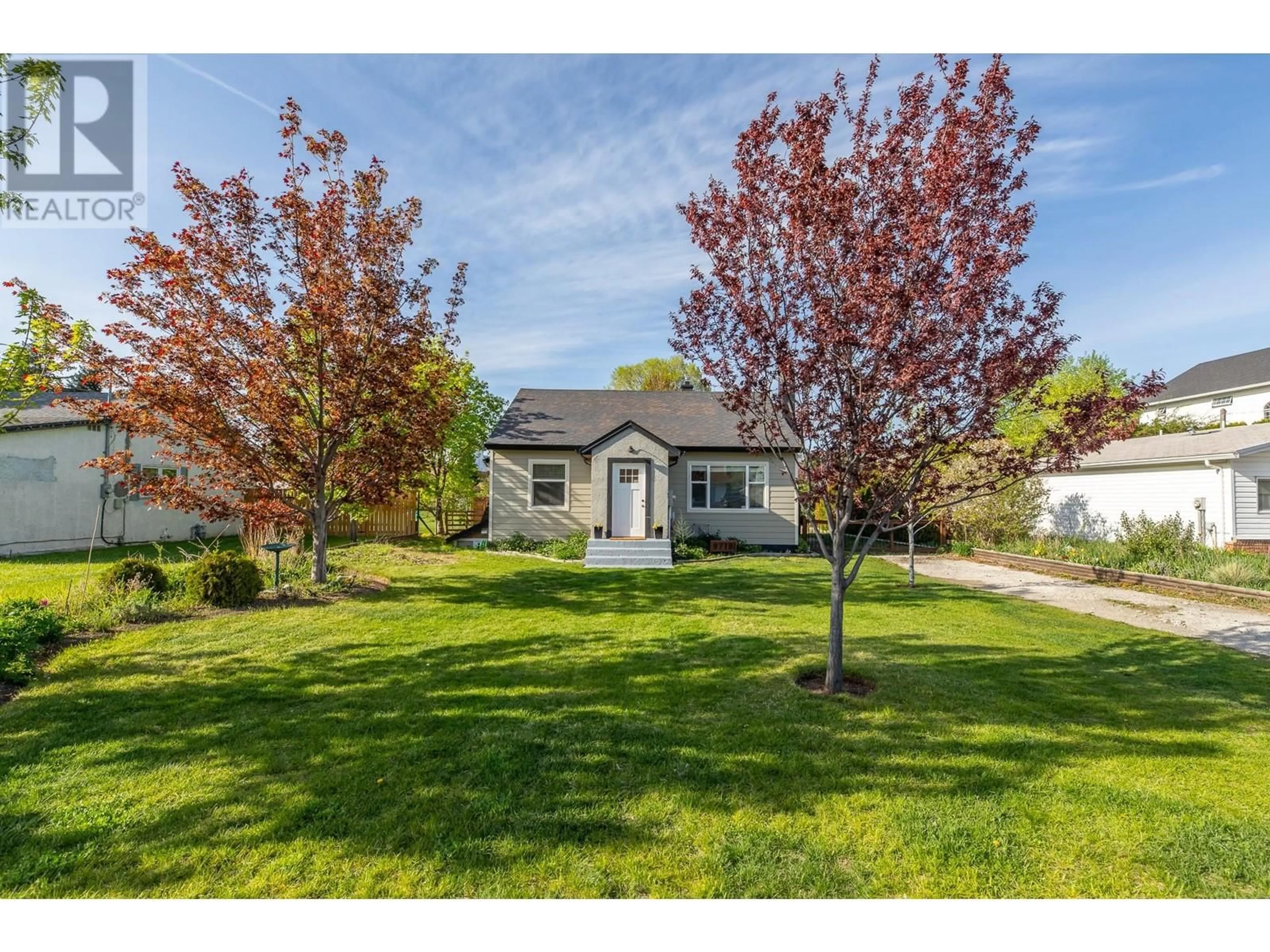 Home with vinyl exterior material, street for 9718 JULIA STREET, Summerland British Columbia V0H1Z6
