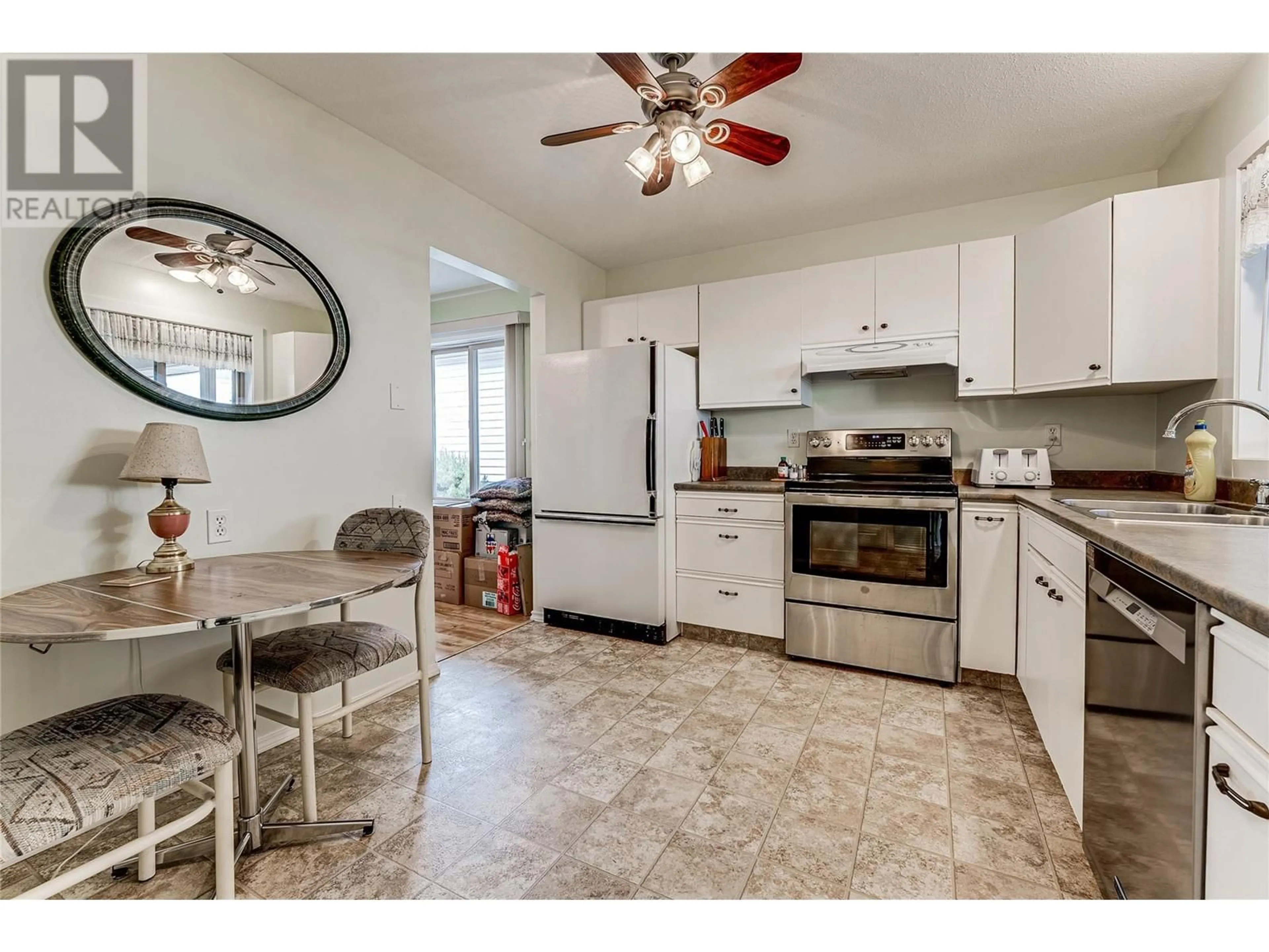 Open concept kitchen, ceramic/tile floor for 10 - 4303 27 AVENUE, Vernon British Columbia V1T6L2