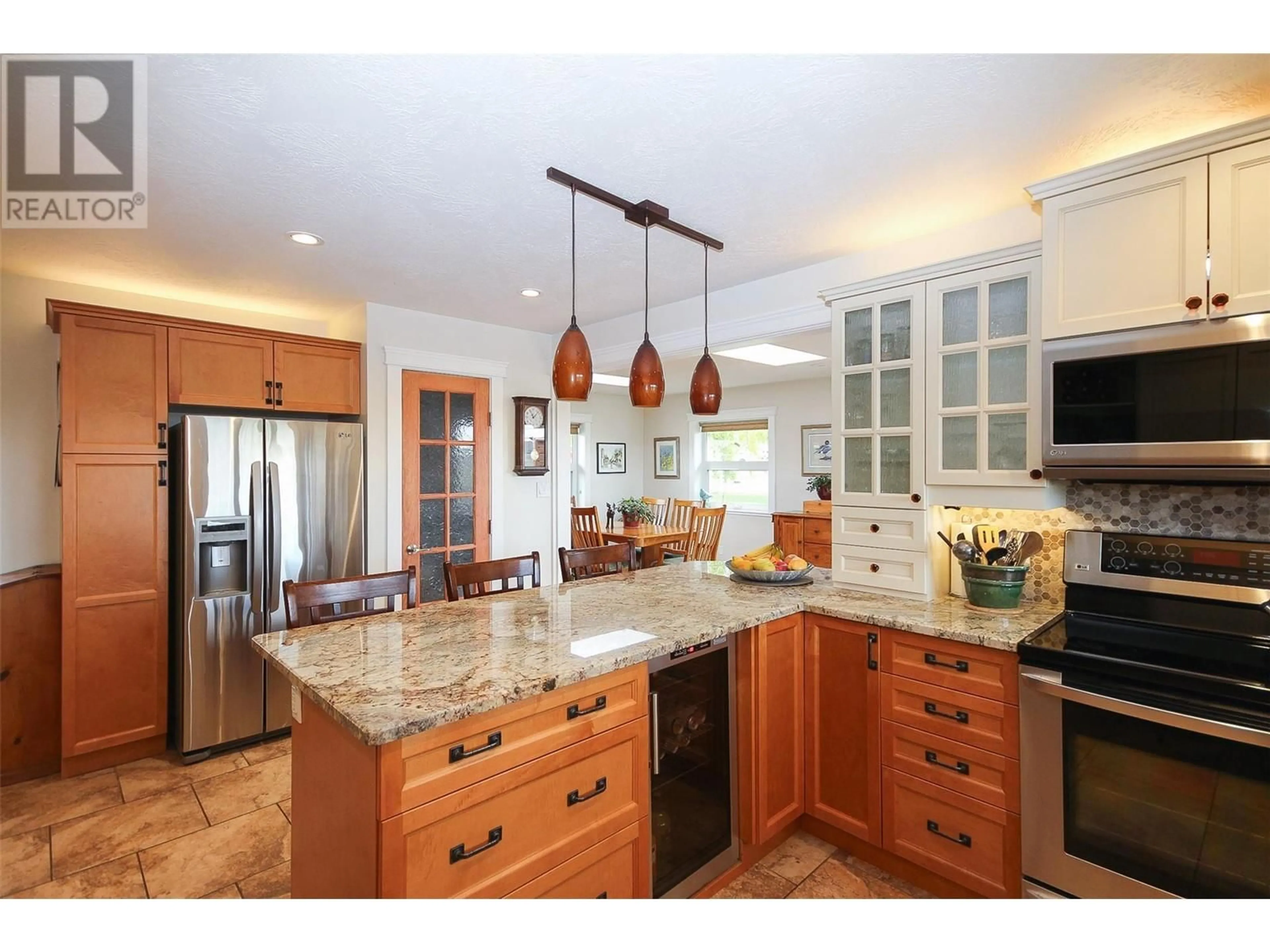 Open concept kitchen, ceramic/tile floor for 1917 93 AVENUE, Dawson Creek British Columbia V1G1E9