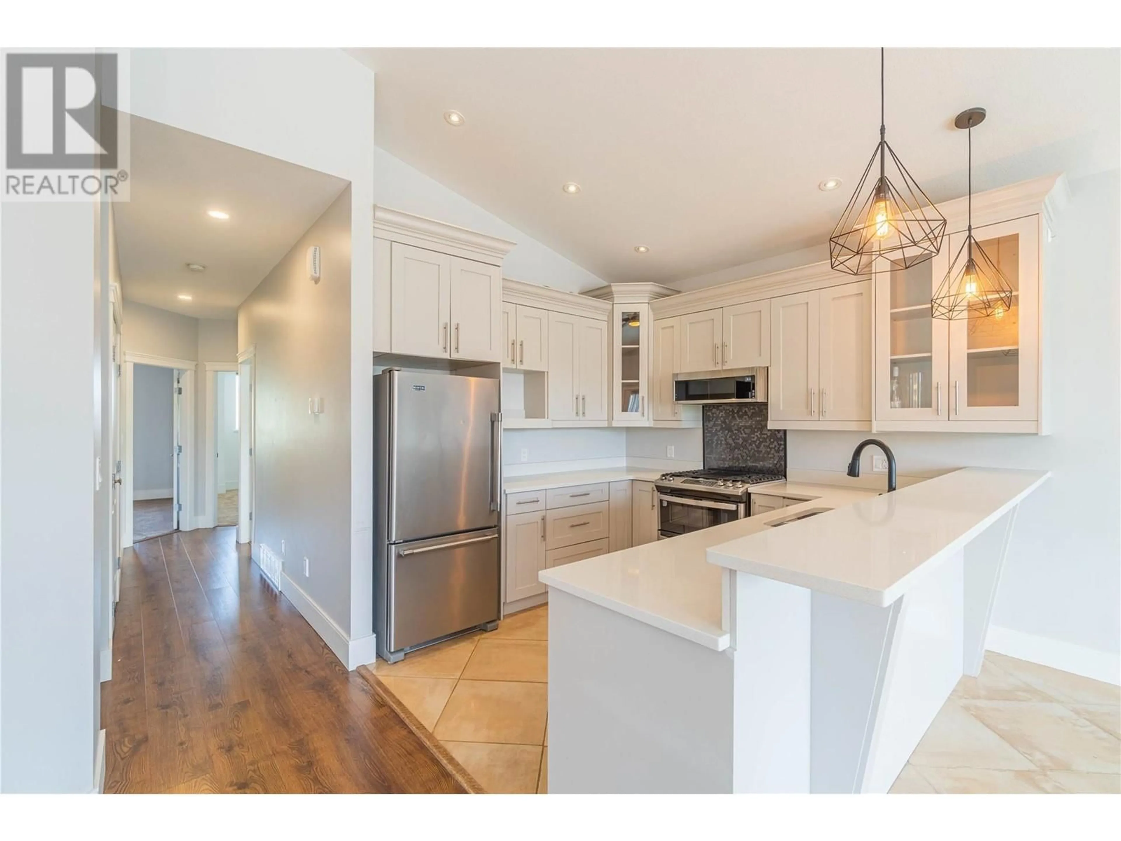 Open concept kitchen, wood/laminate floor for 678 SETTLEMENT ROAD, Kamloops British Columbia V2B6J1