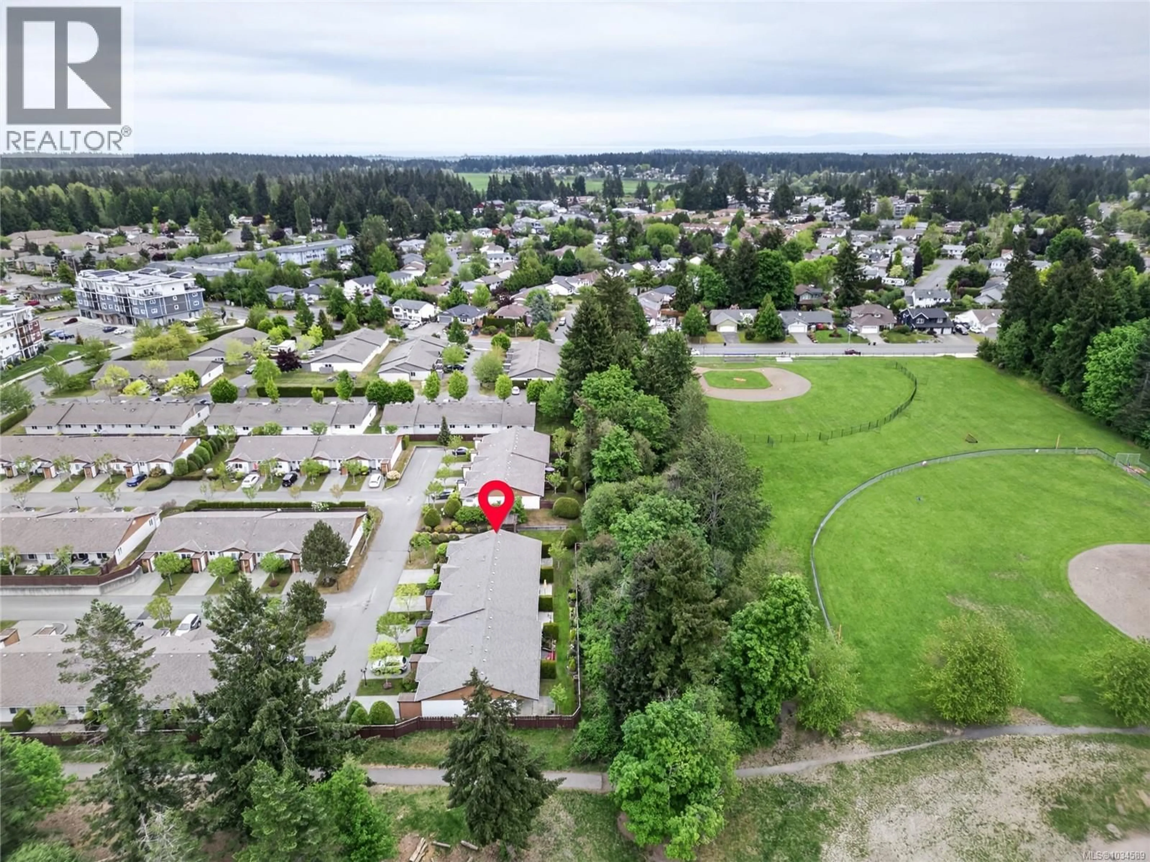 A pic from outside/outdoor area/front of a property/back of a property/a pic from drone, mountain view for 18 - 2197 MURRELET DRIVE, Comox British Columbia V9M3Y1