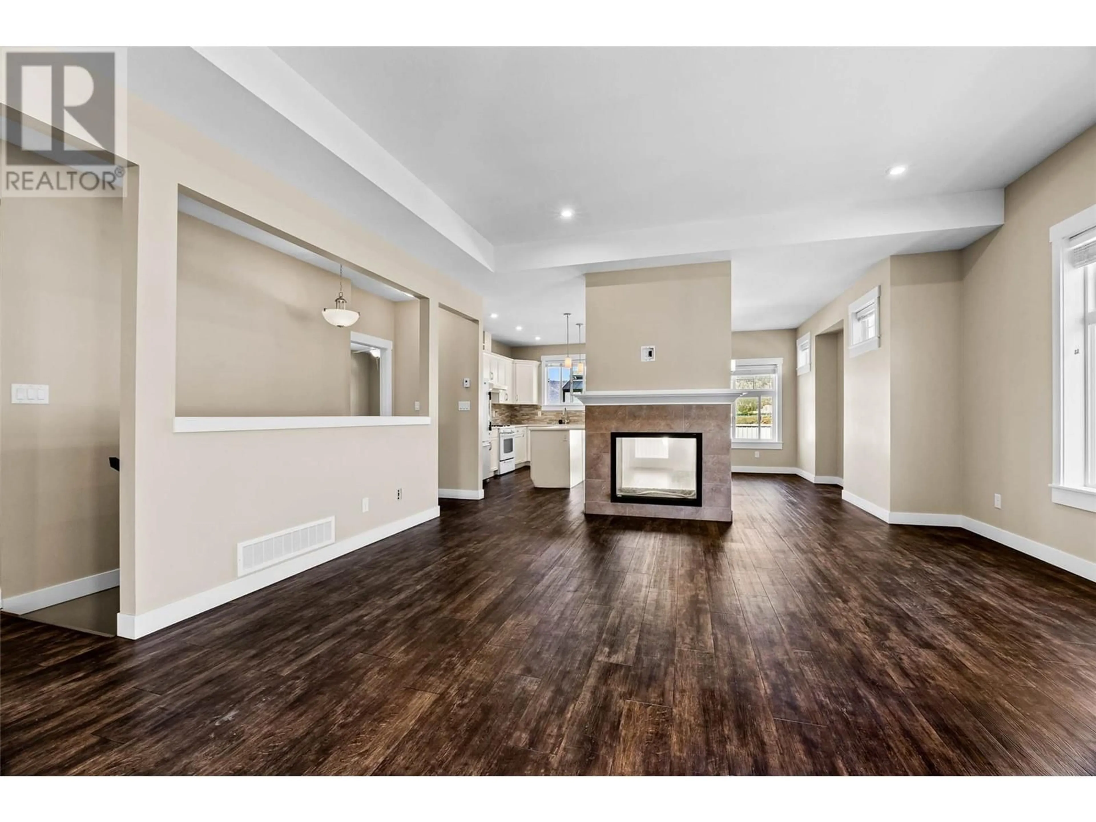 Open concept kitchen, wood/laminate floor for 103 - 2514 SPRINGBANK AVENUE, Merritt British Columbia V1K1B8