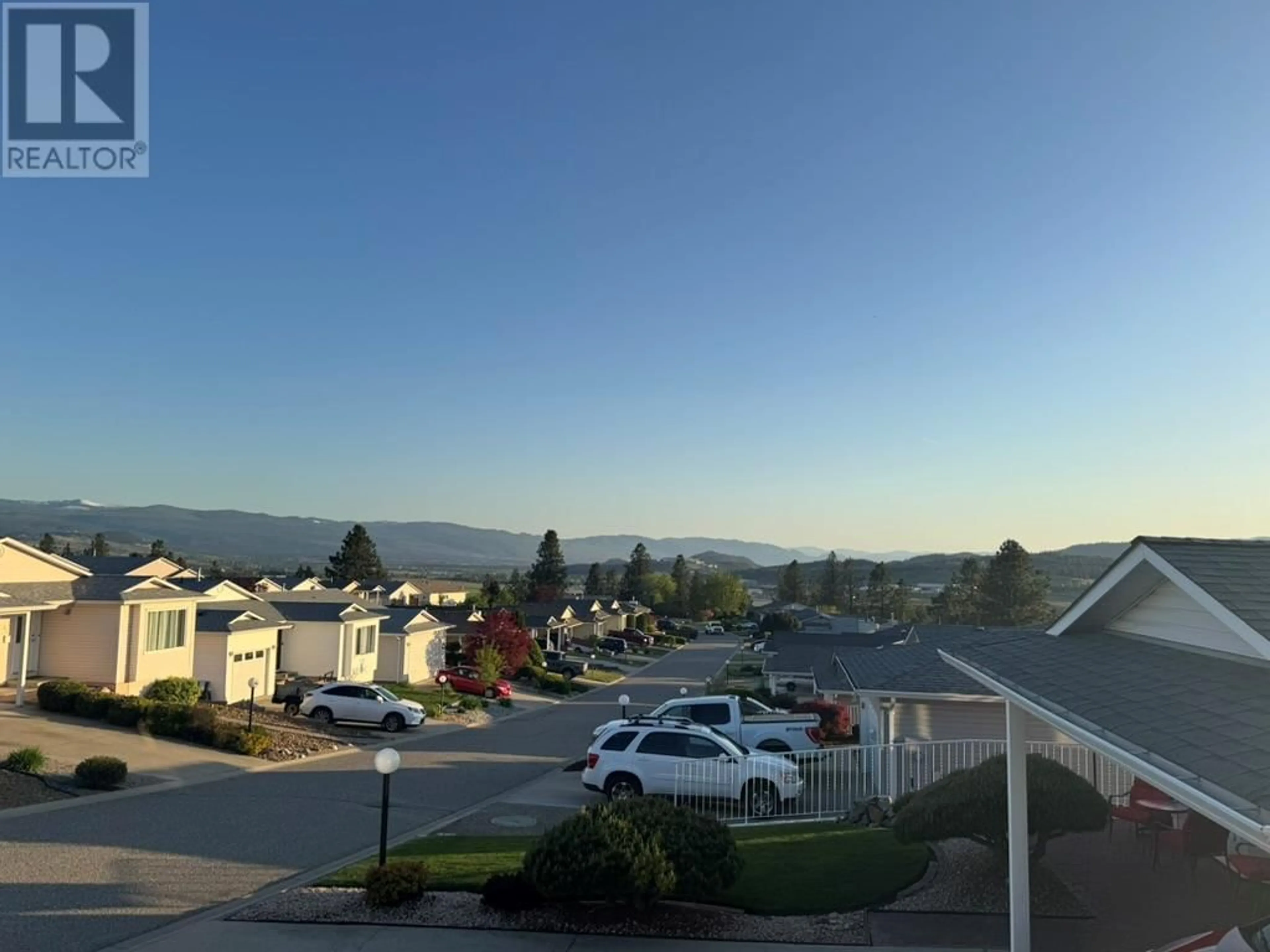 A pic from outside/outdoor area/front of a property/back of a property/a pic from drone, mountain view for 46 - 6400 SPENCER ROAD, Kelowna British Columbia V1X7T6
