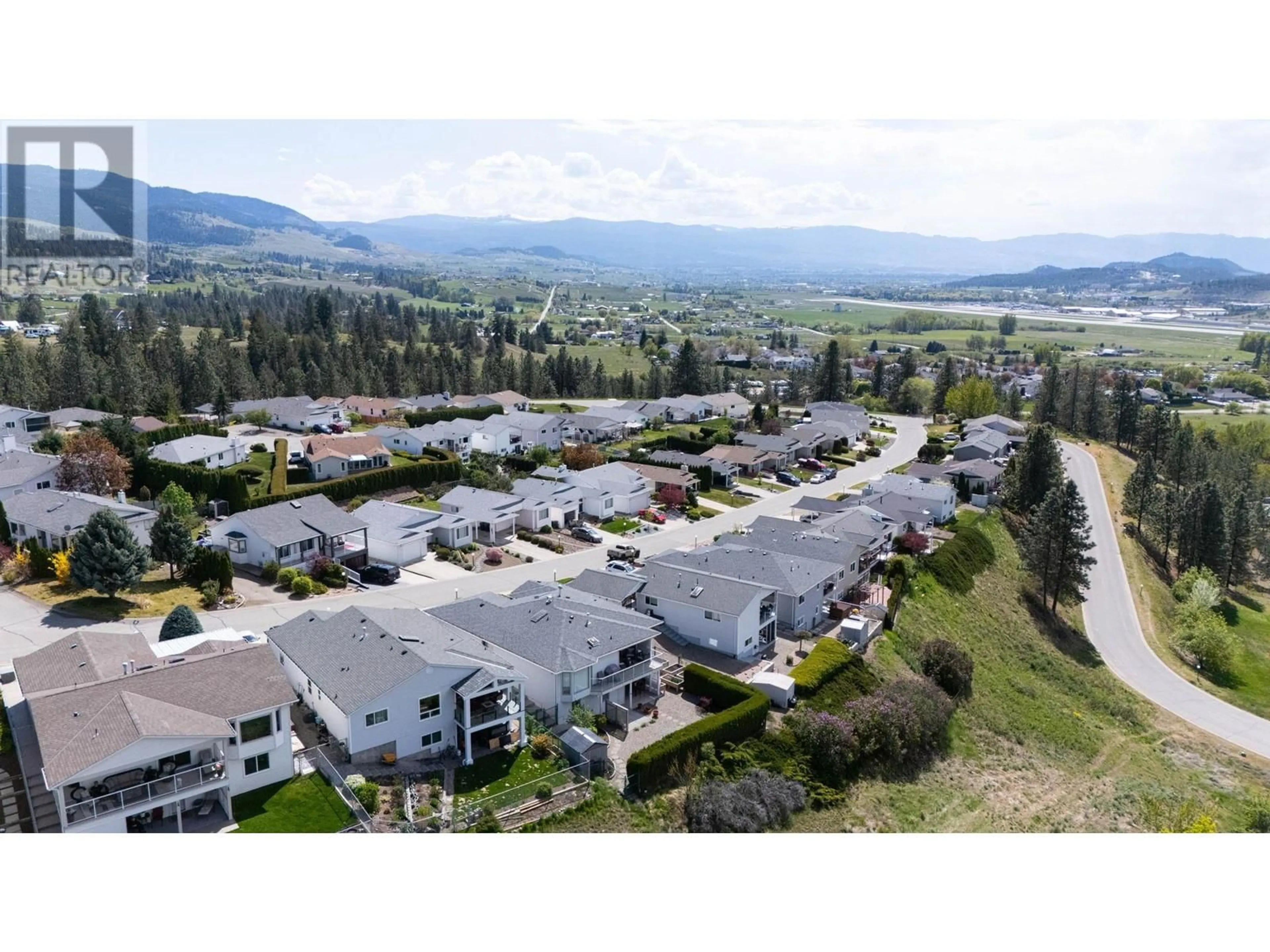 A pic from outside/outdoor area/front of a property/back of a property/a pic from drone, mountain view for 46 - 6400 SPENCER ROAD, Kelowna British Columbia V1X7T6