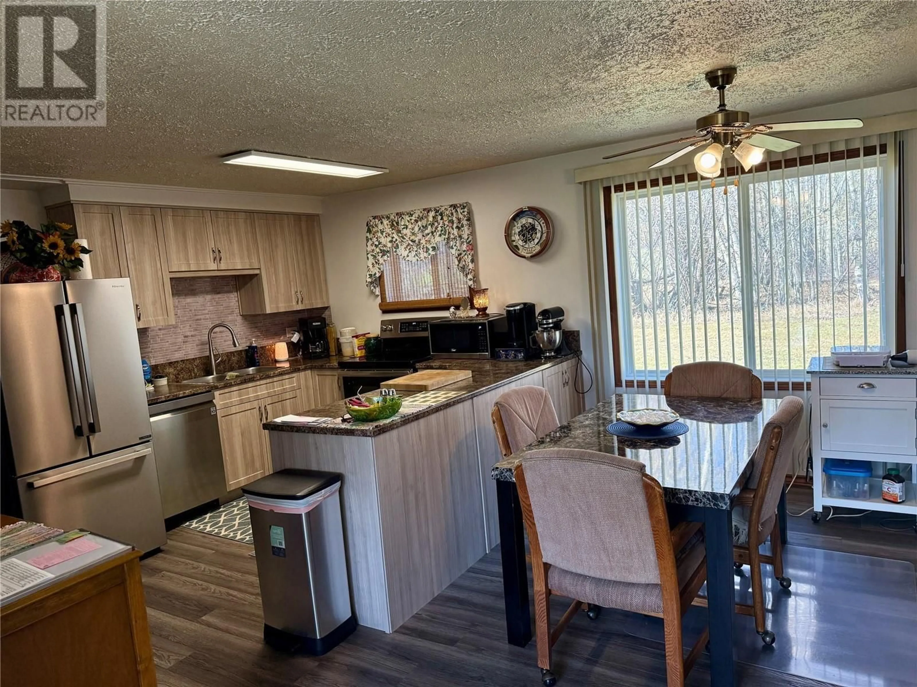 Open concept kitchen, wood/laminate floor for 3757 212 ROAD, Dawson Creek British Columbia V1G4G3