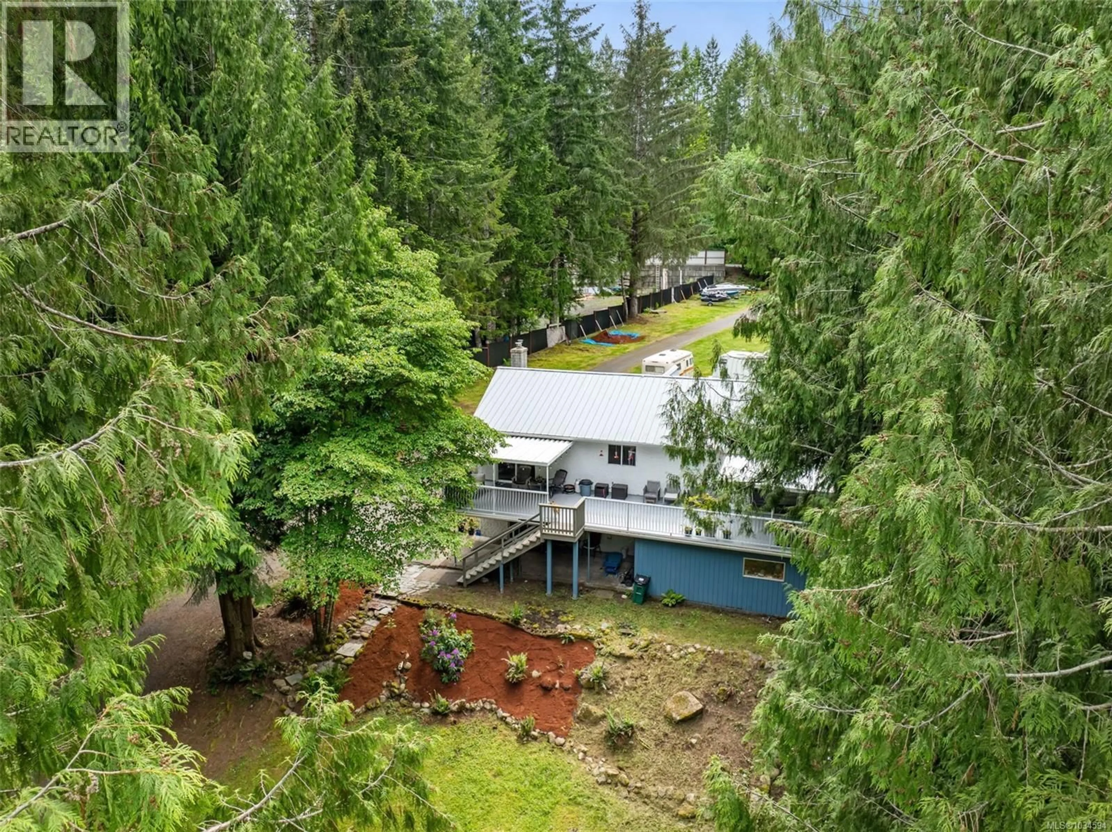 A pic from outside/outdoor area/front of a property/back of a property/a pic from drone, forest/trees view for 8256 SA-SEEN-OS CRESCENT, Youbou British Columbia V0R3E1