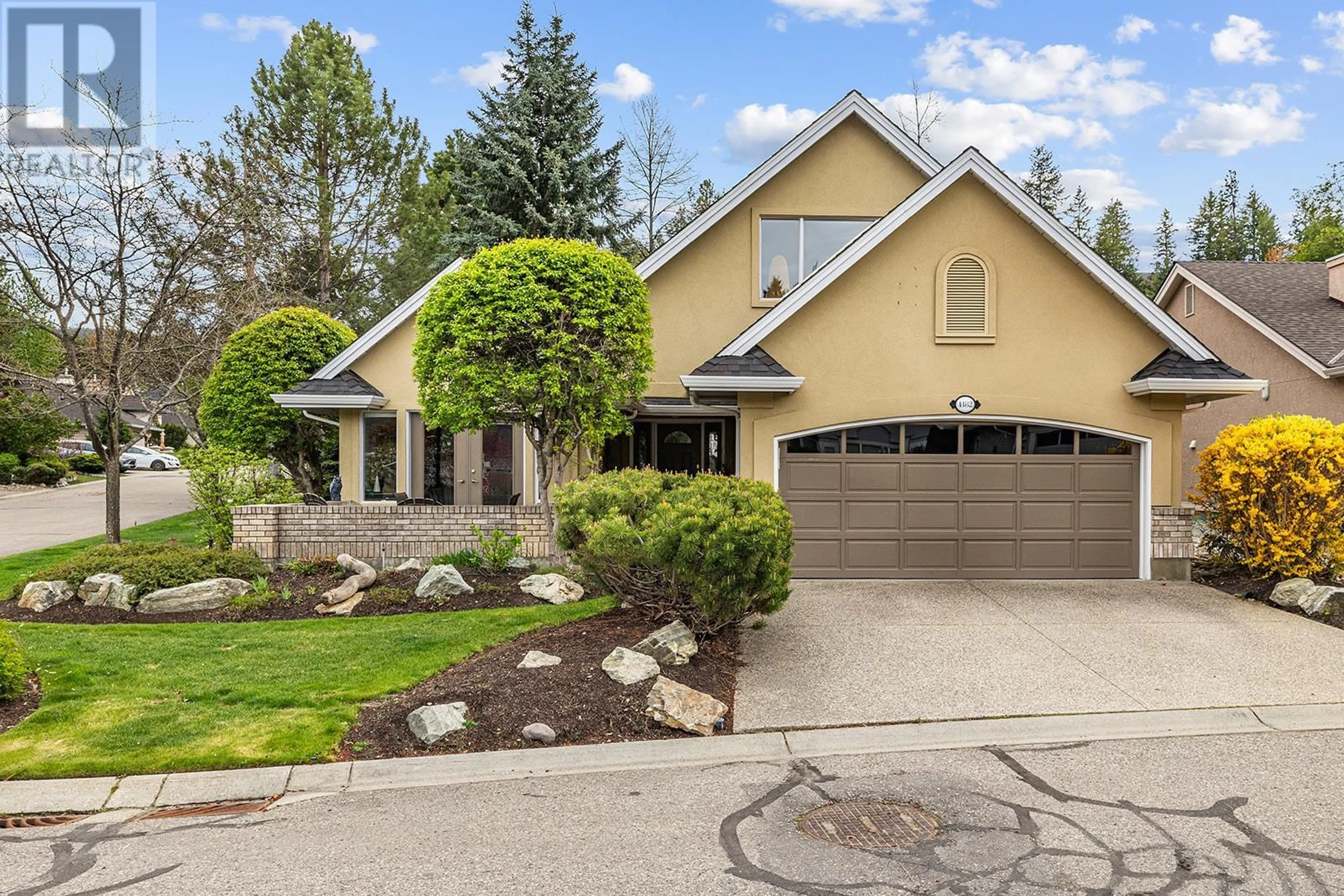 Home with vinyl exterior material, street for 4182 GALLAGHERS GROVE, Kelowna British Columbia V1W3Z9