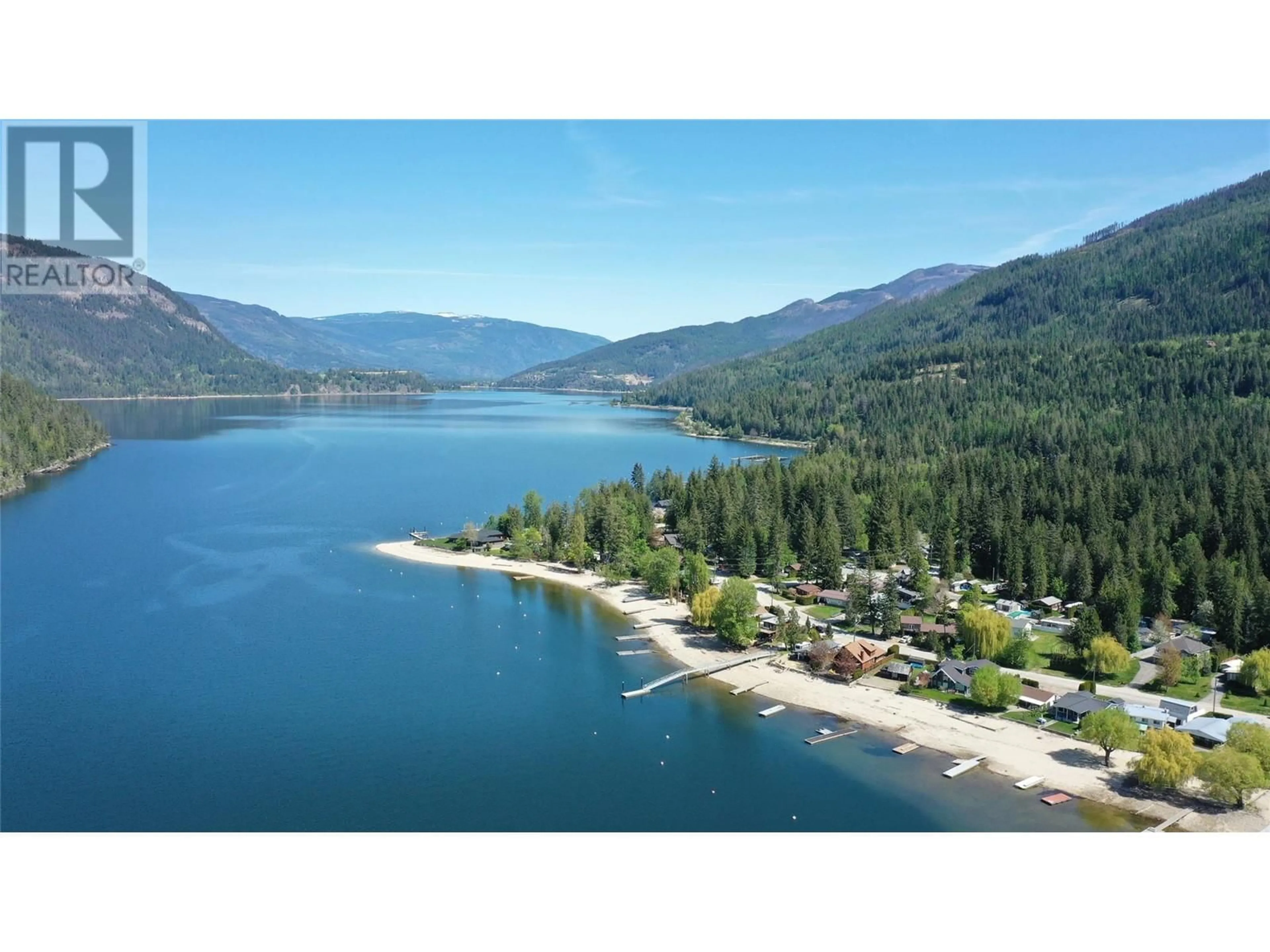 A pic from outside/outdoor area/front of a property/back of a property/a pic from drone, water/lake/river/ocean view for 8979 HUMMINGBIRD FRONTAGE ROAD, Swansea Point British Columbia V0E2K2