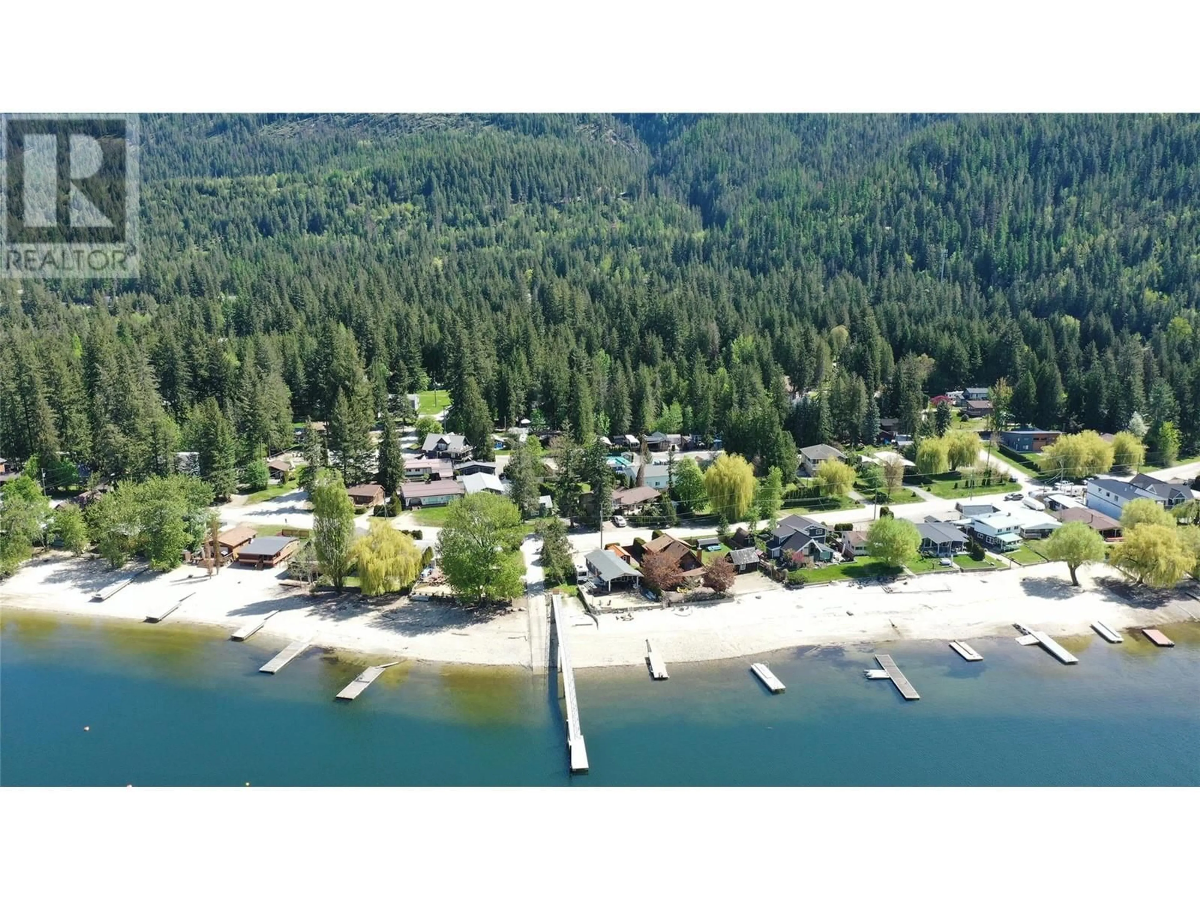 A pic from outside/outdoor area/front of a property/back of a property/a pic from drone, water/lake/river/ocean view for 8979 HUMMINGBIRD FRONTAGE ROAD, Swansea Point British Columbia V0E2K2
