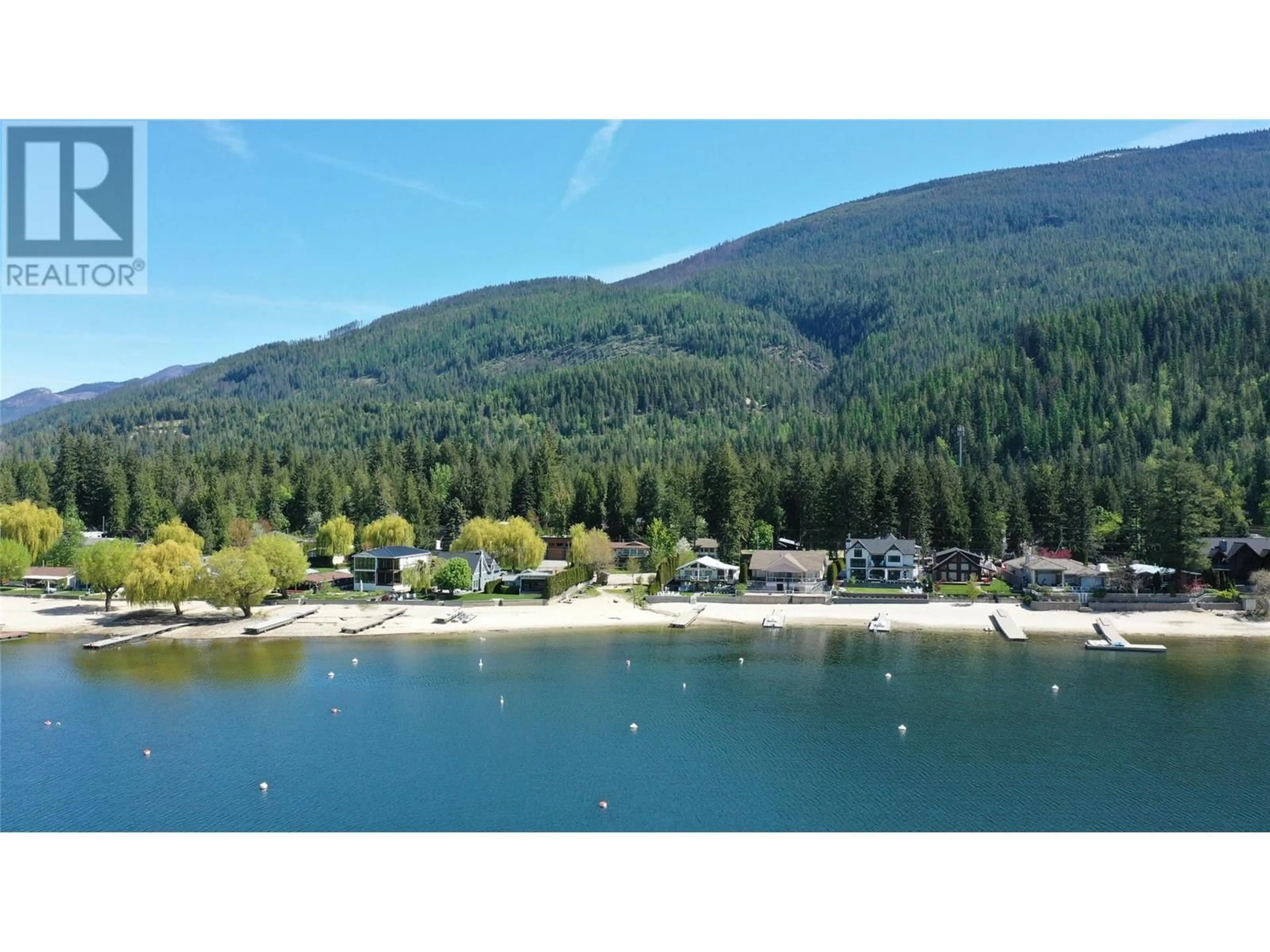 A pic from outside/outdoor area/front of a property/back of a property/a pic from drone, water/lake/river/ocean view for 8979 HUMMINGBIRD FRONTAGE ROAD, Swansea Point British Columbia V0E2K2
