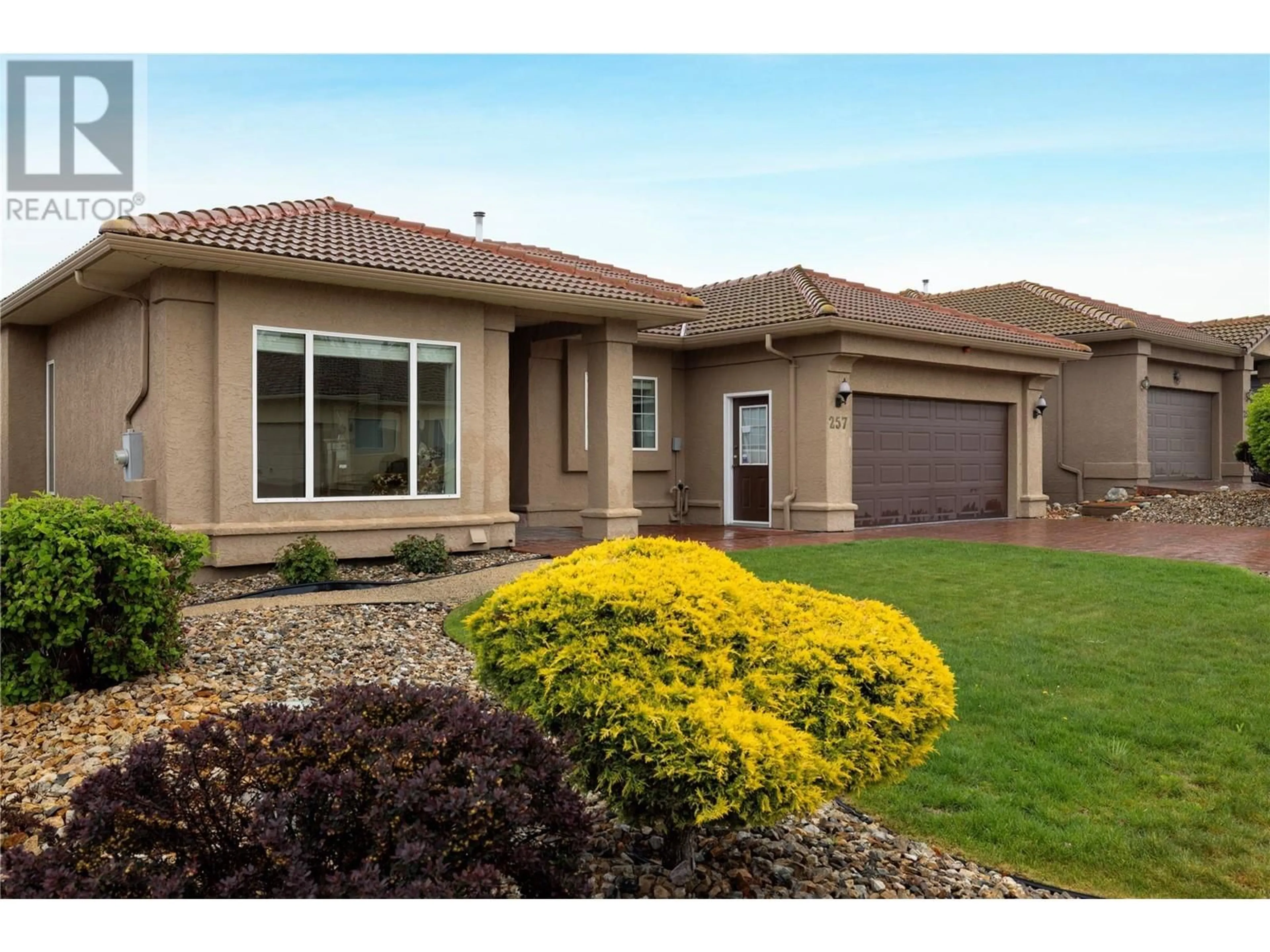Home with vinyl exterior material, street for 257 COUNTRY ESTATE DRIVE, Vernon British Columbia V1B2V3