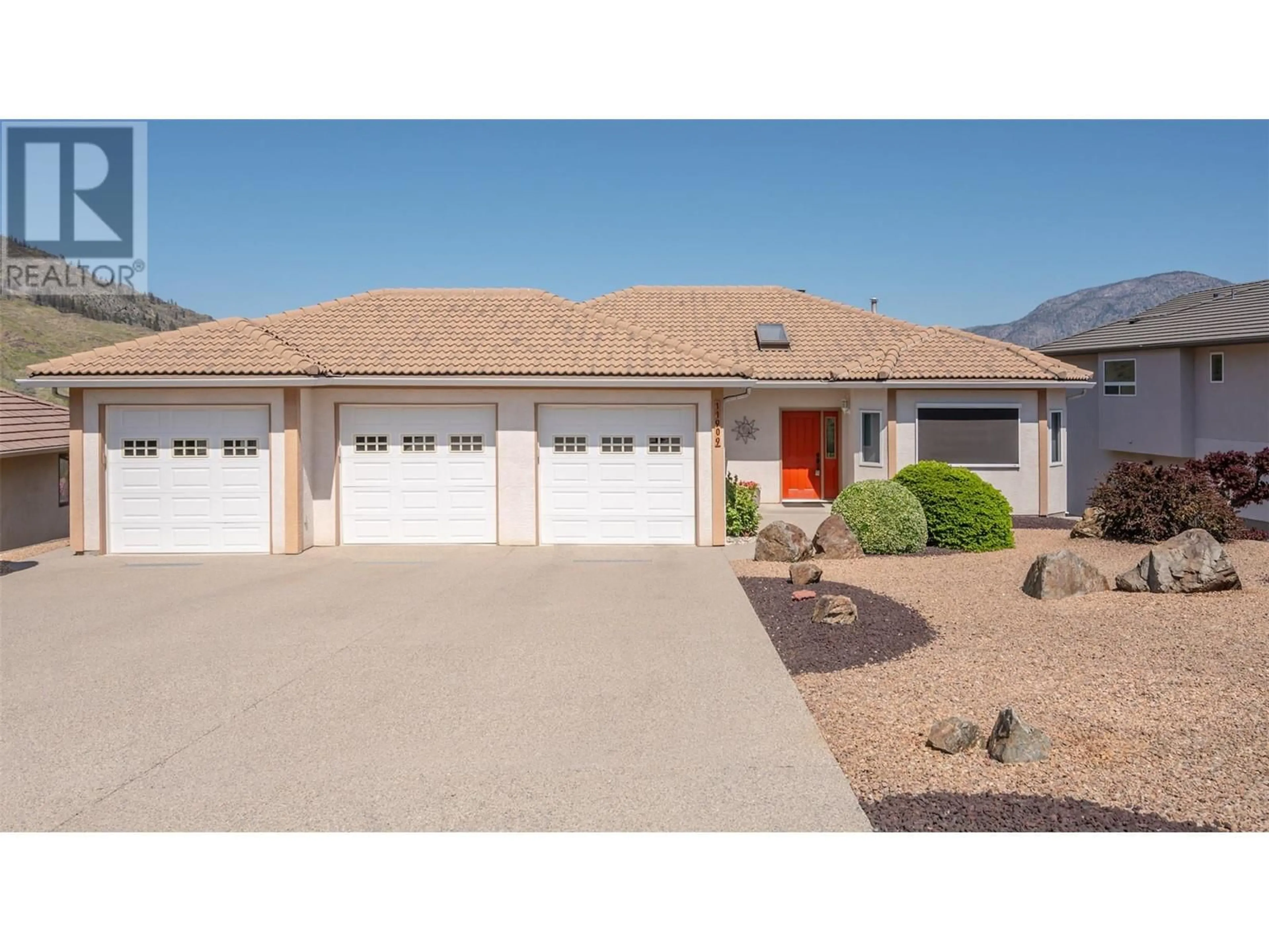 Home with vinyl exterior material, street for 11909 OLYMPIC VIEW DRIVE, Osoyoos British Columbia V0H1V4