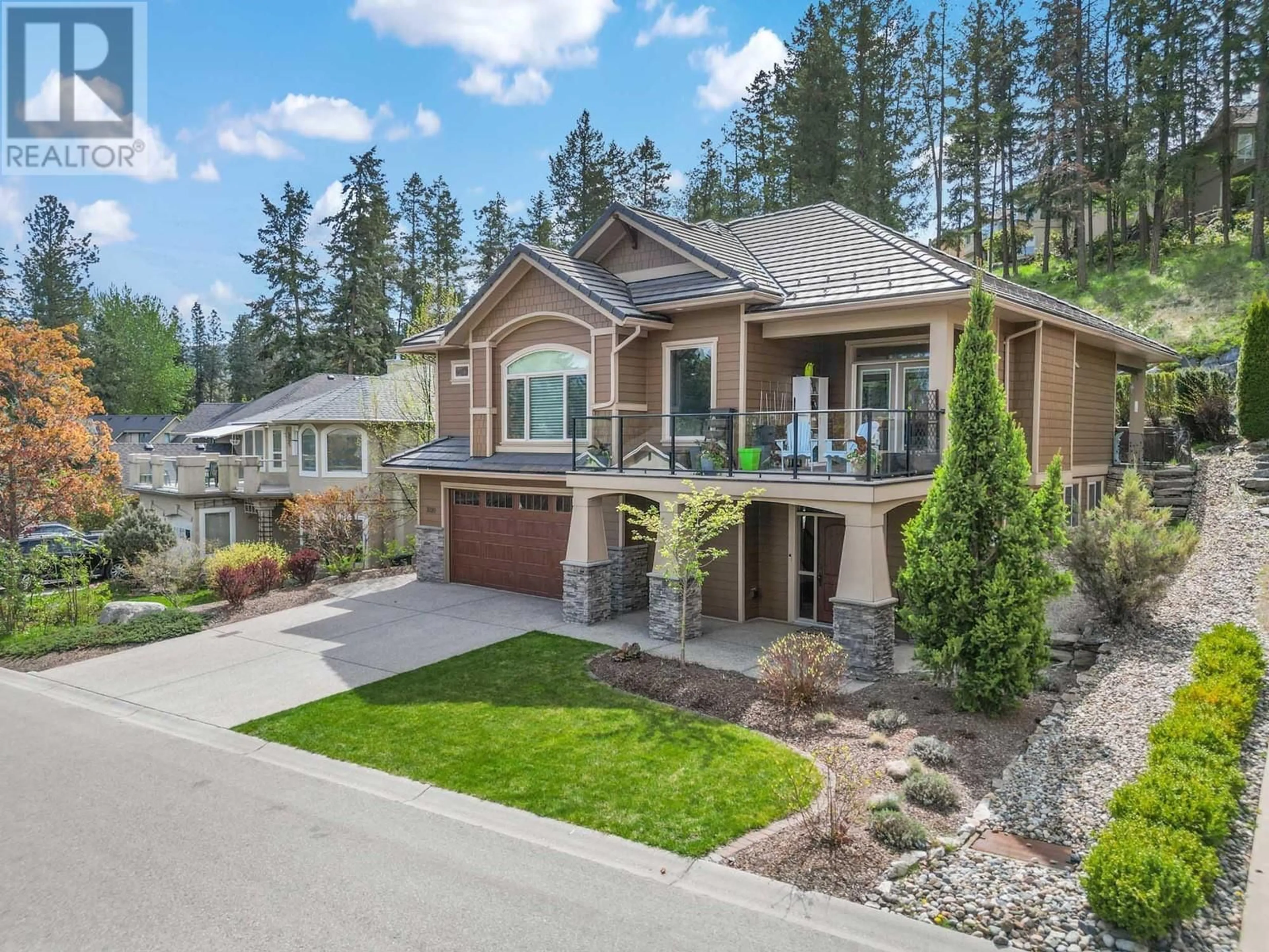 Home with brick exterior material, mountain view for 3920 GALLAGHERS CIRCLE, Kelowna British Columbia V1W3Z9