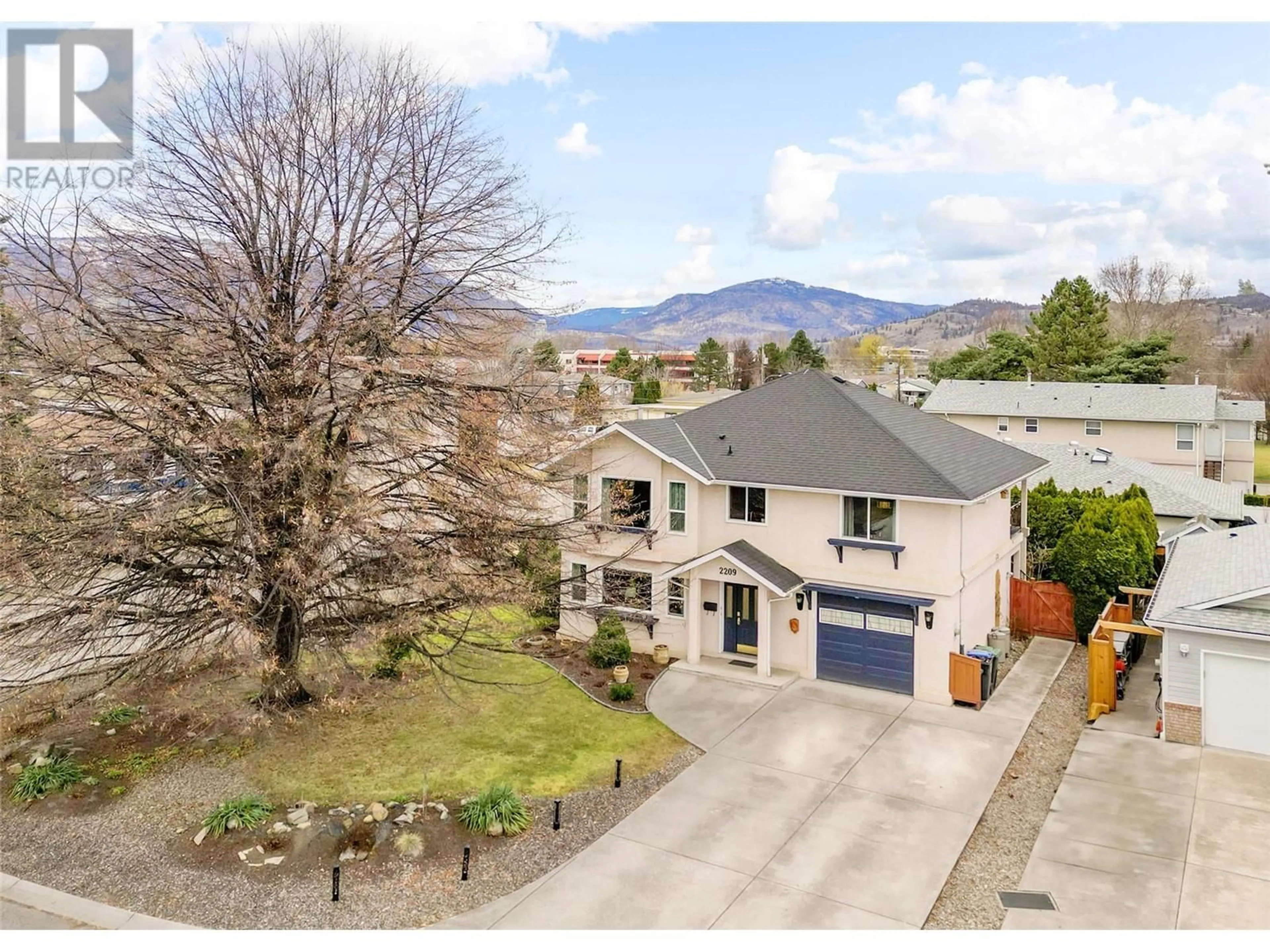 A pic from outside/outdoor area/front of a property/back of a property/a pic from drone, mountain view for 2209 STILLINGFLEET COURT, Kelowna British Columbia V1Y9N3