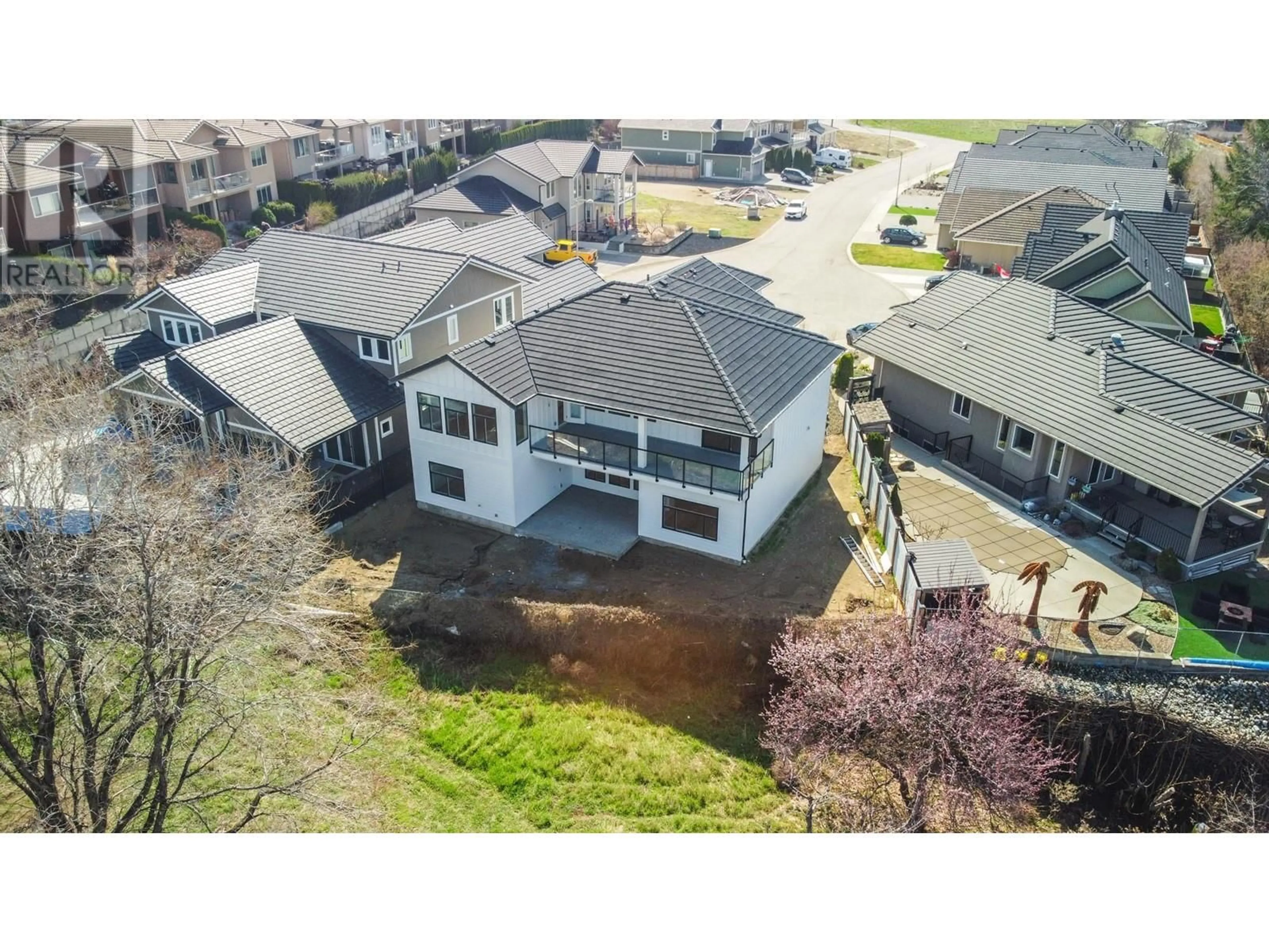 A pic from outside/outdoor area/front of a property/back of a property/a pic from drone, building for 18 CHARDONNAY COURT, Osoyoos British Columbia V0H1V6
