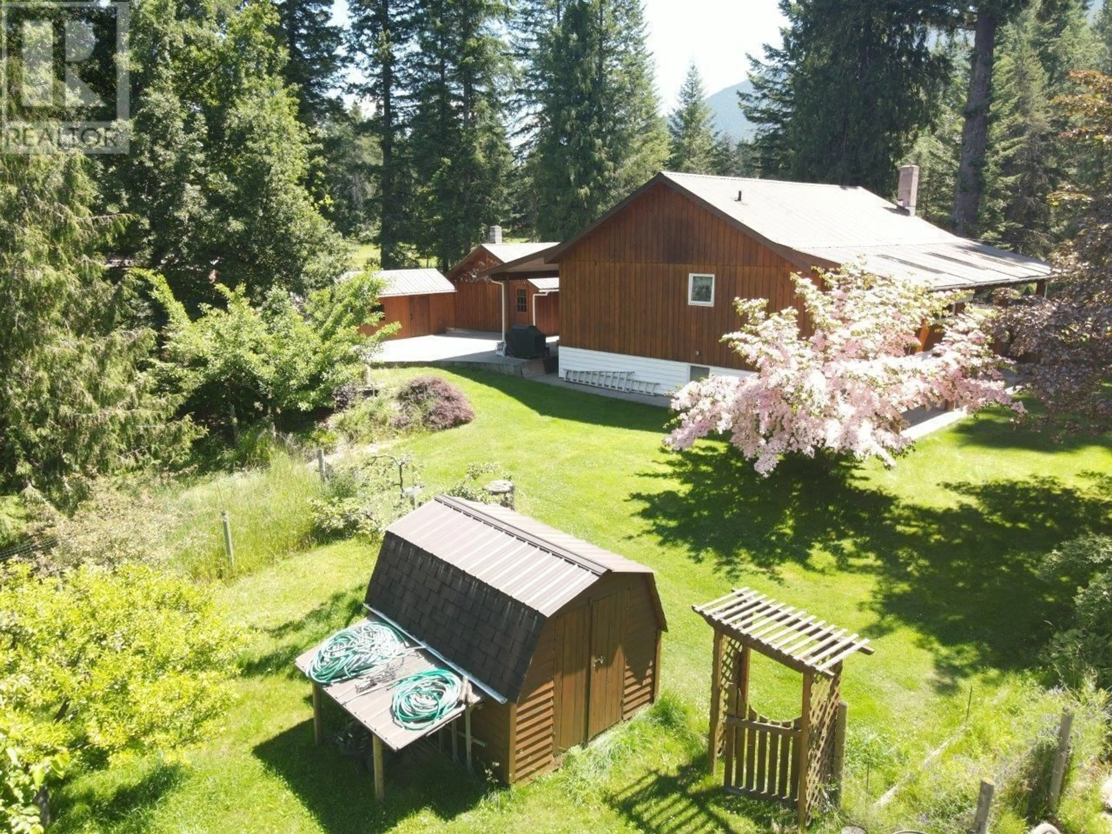 A pic from outside/outdoor area/front of a property/back of a property/a pic from drone, forest/trees view for 7047 HARROP-PROCTER ROAD, Harrop British Columbia V1L6R3