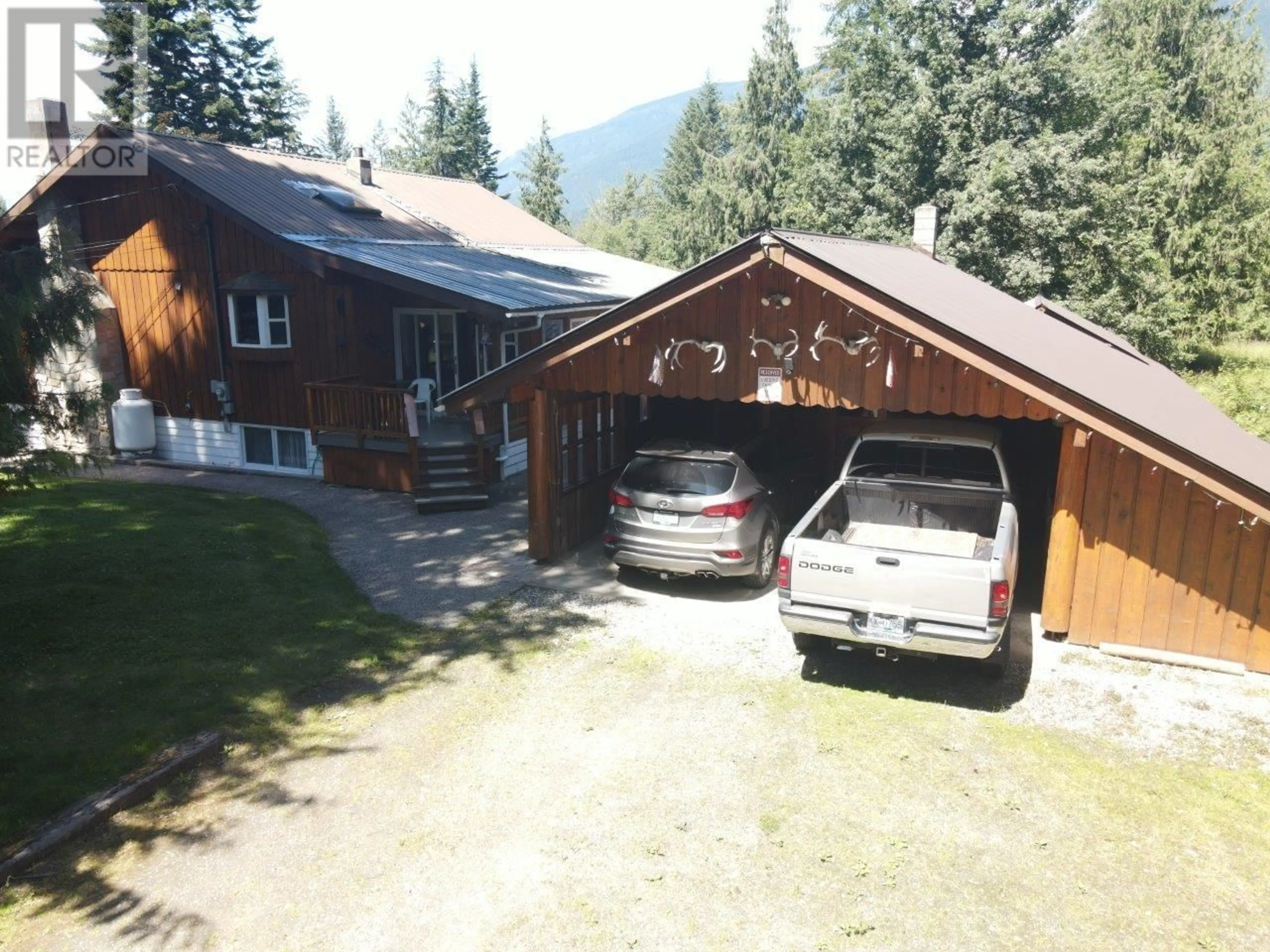A pic from outside/outdoor area/front of a property/back of a property/a pic from drone, mountain view for 7047 HARROP-PROCTER ROAD, Harrop British Columbia V1L6R3